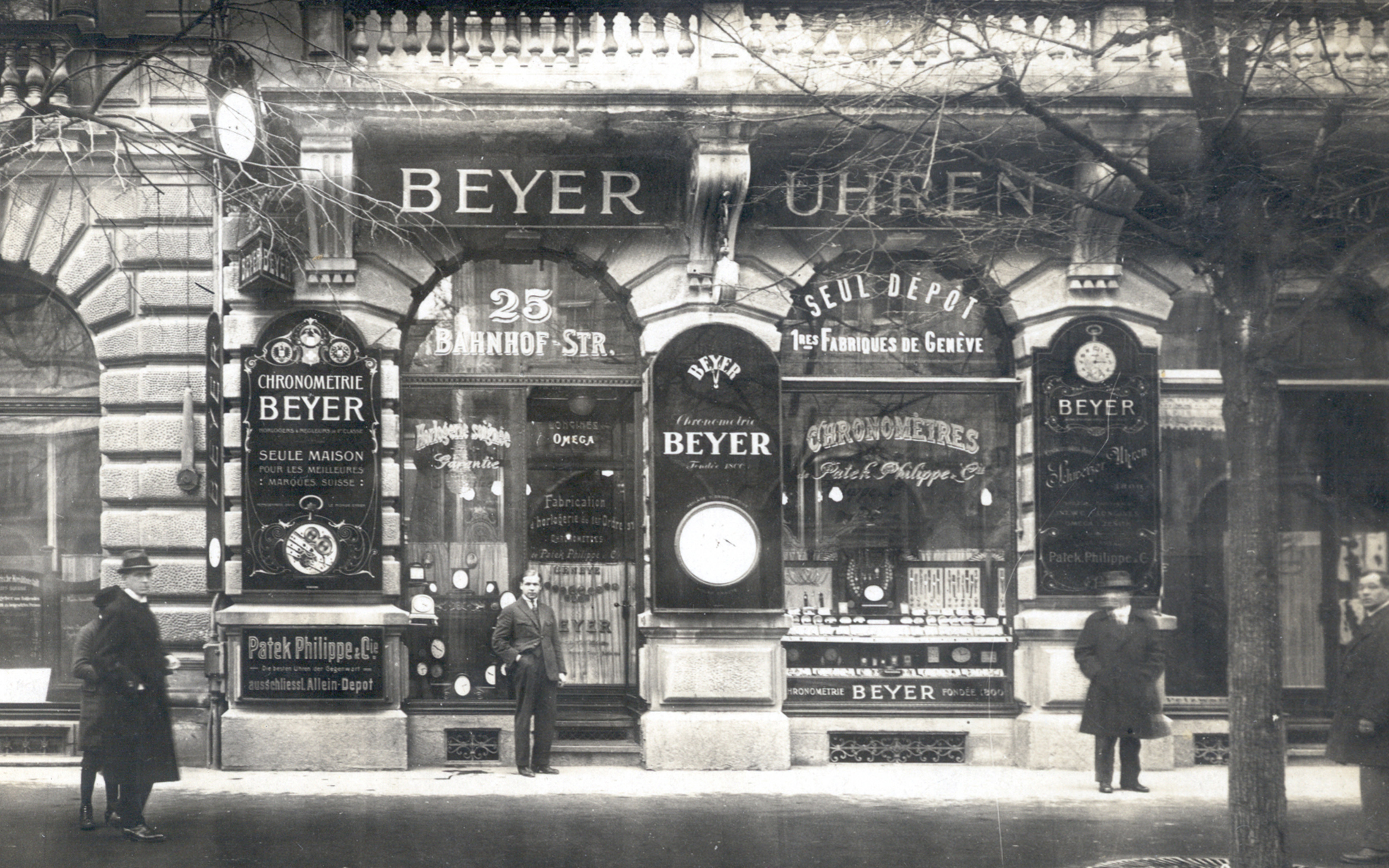 Vintage logos for watchmakers including Omega, Longines and Patek Philippe displayed in the windows of Beyer Chronometrie at Bahnhofstrasse 25 in Zurich, around 1910, before the move to the family firm’s present home at number 31
