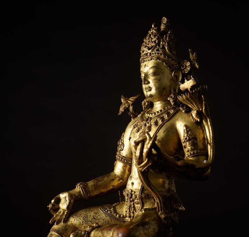 A gilt copper alloy figure of Manjushri, central Tibet, circa 12th century. 15 1/2 in (39.4 cm) high. Estimate: HK$16,000,000 – 20,000,000. Offered in Indian, Himalayan and Southeast Asian Art sale on 3 November 2025 at Christie’s in Hong Kong