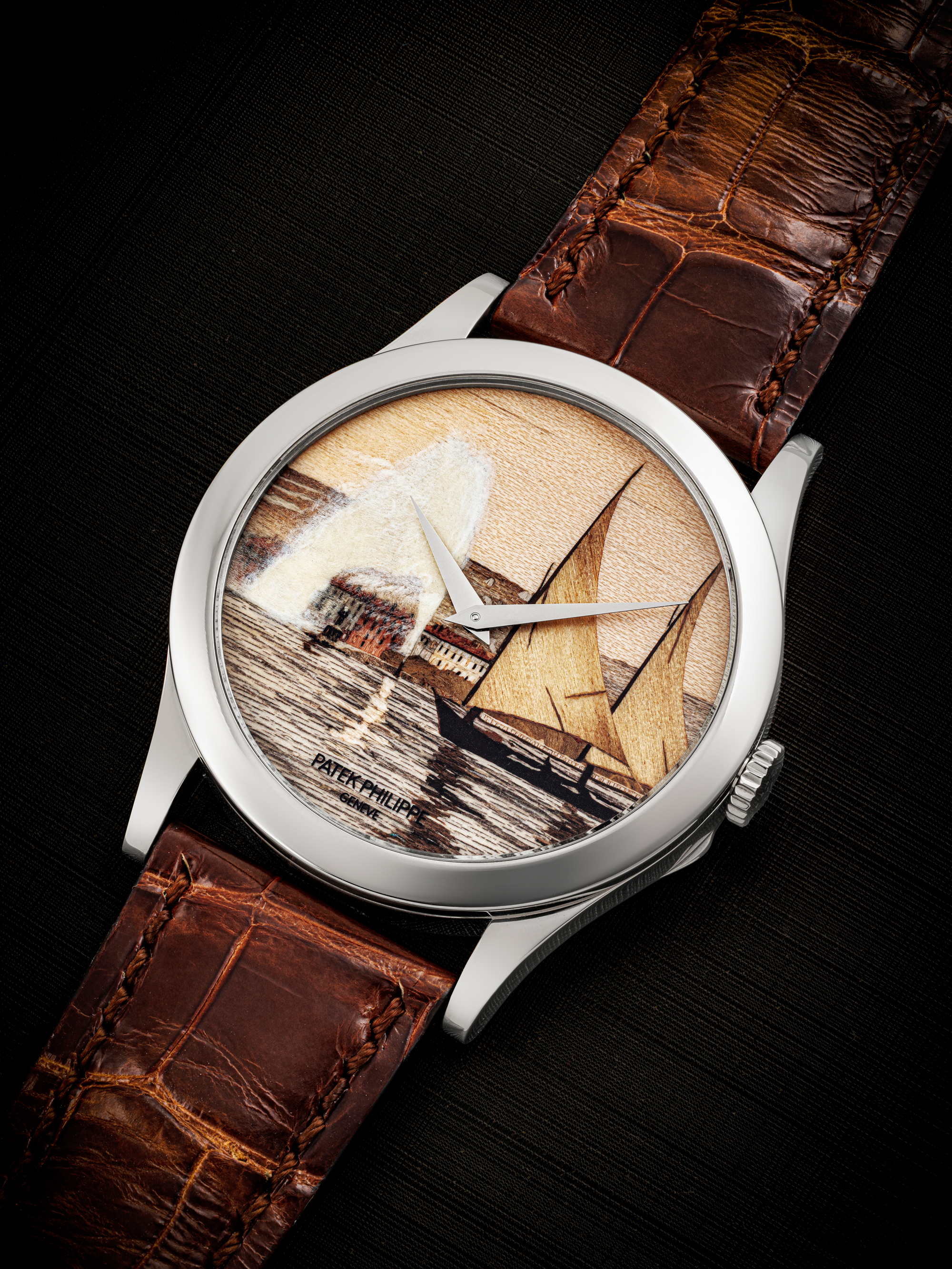 Patek Philippe. A rare 18k white gold automatic wristwatch with marquetry dial featuring lake scene with sailboat. Ref. 5089G.  Estimate: HK$600,000-1,200,000. Offered in The John Shaw Patek Philippe Collection on 26 November 2025 at Christie’s in Hong Kong 