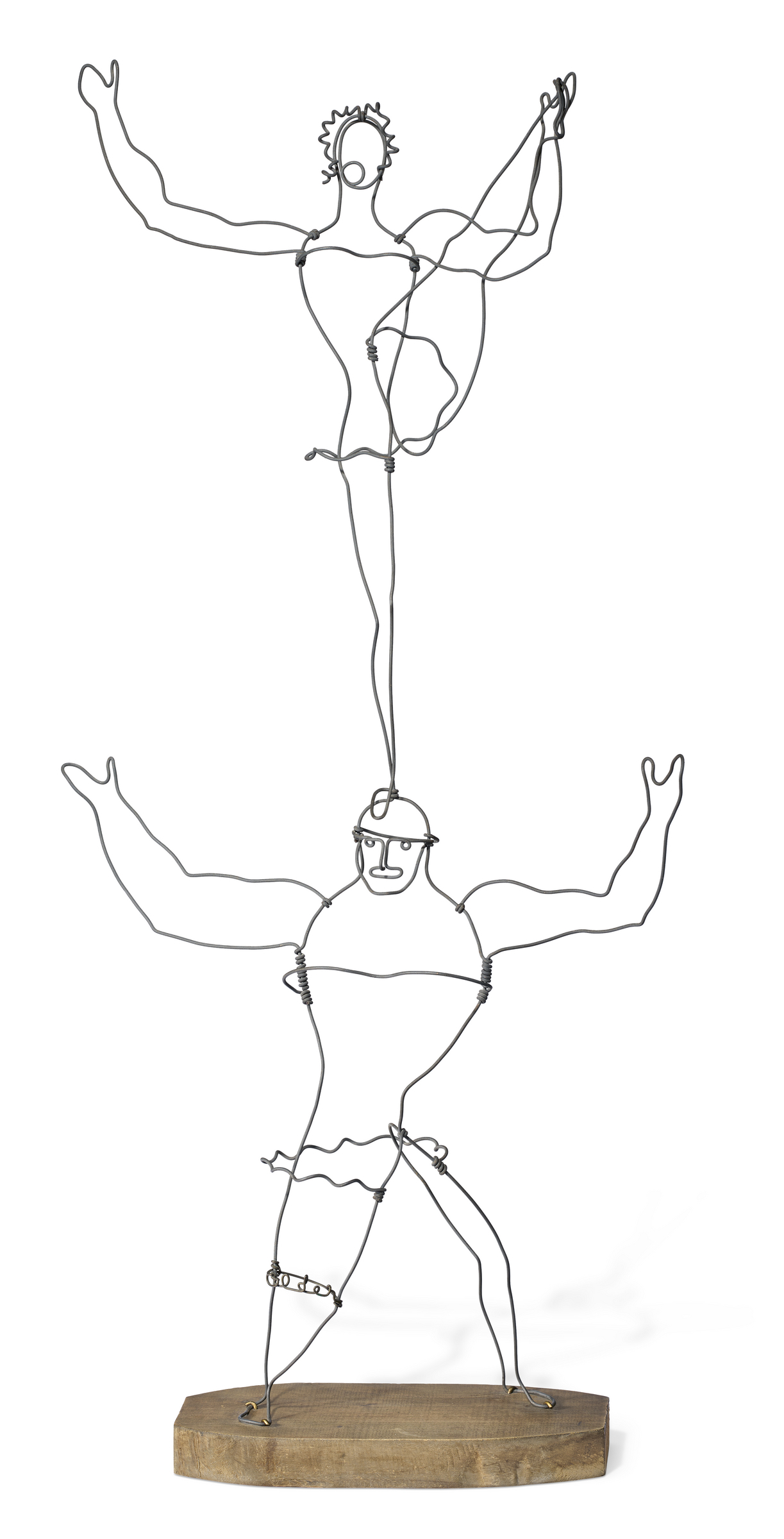 This image depicts a wire sculpture of a human figure performing a ballet pose, mounted on a wooden base.