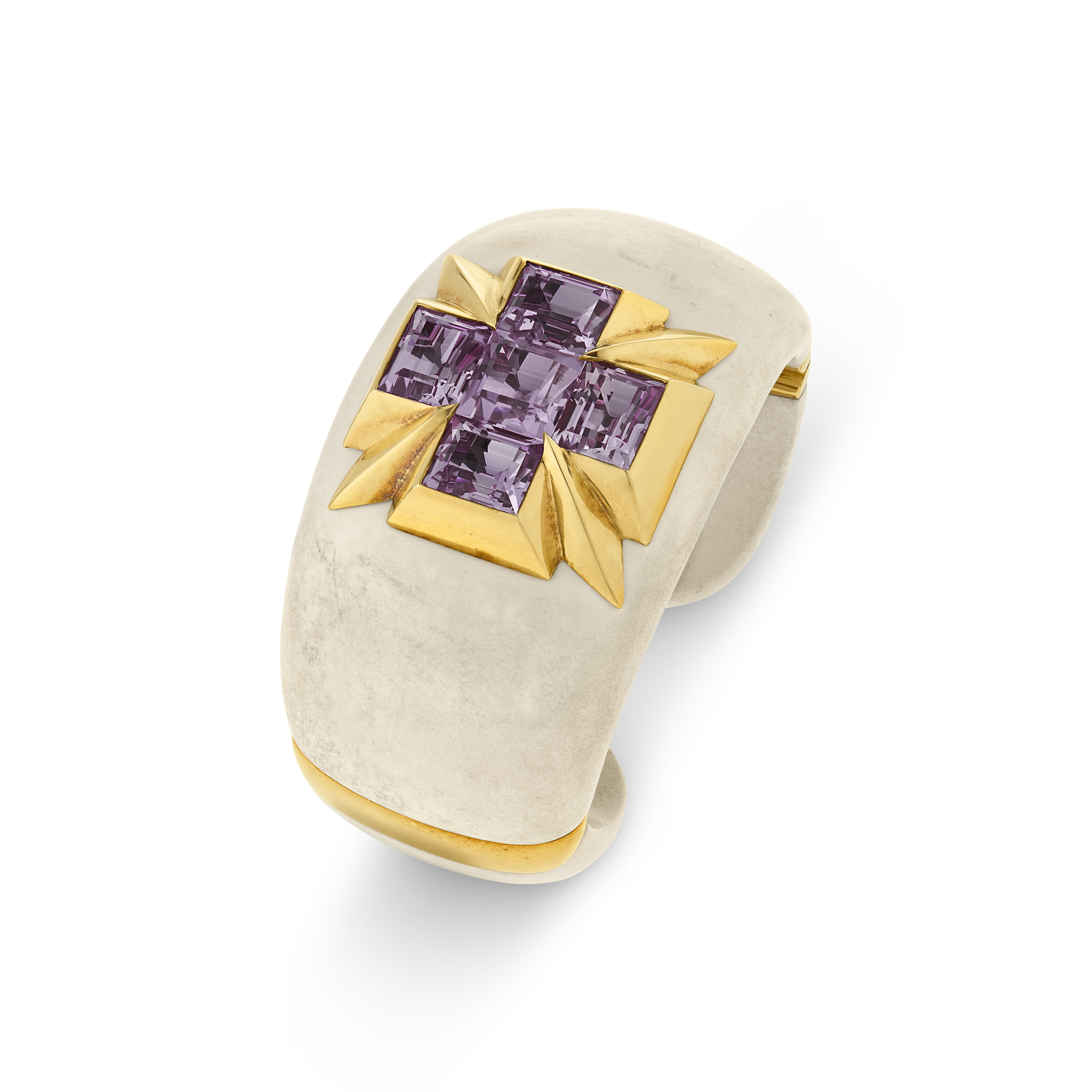 A silver ring with a gold cross design set with four square-cut purple gemstones on top.