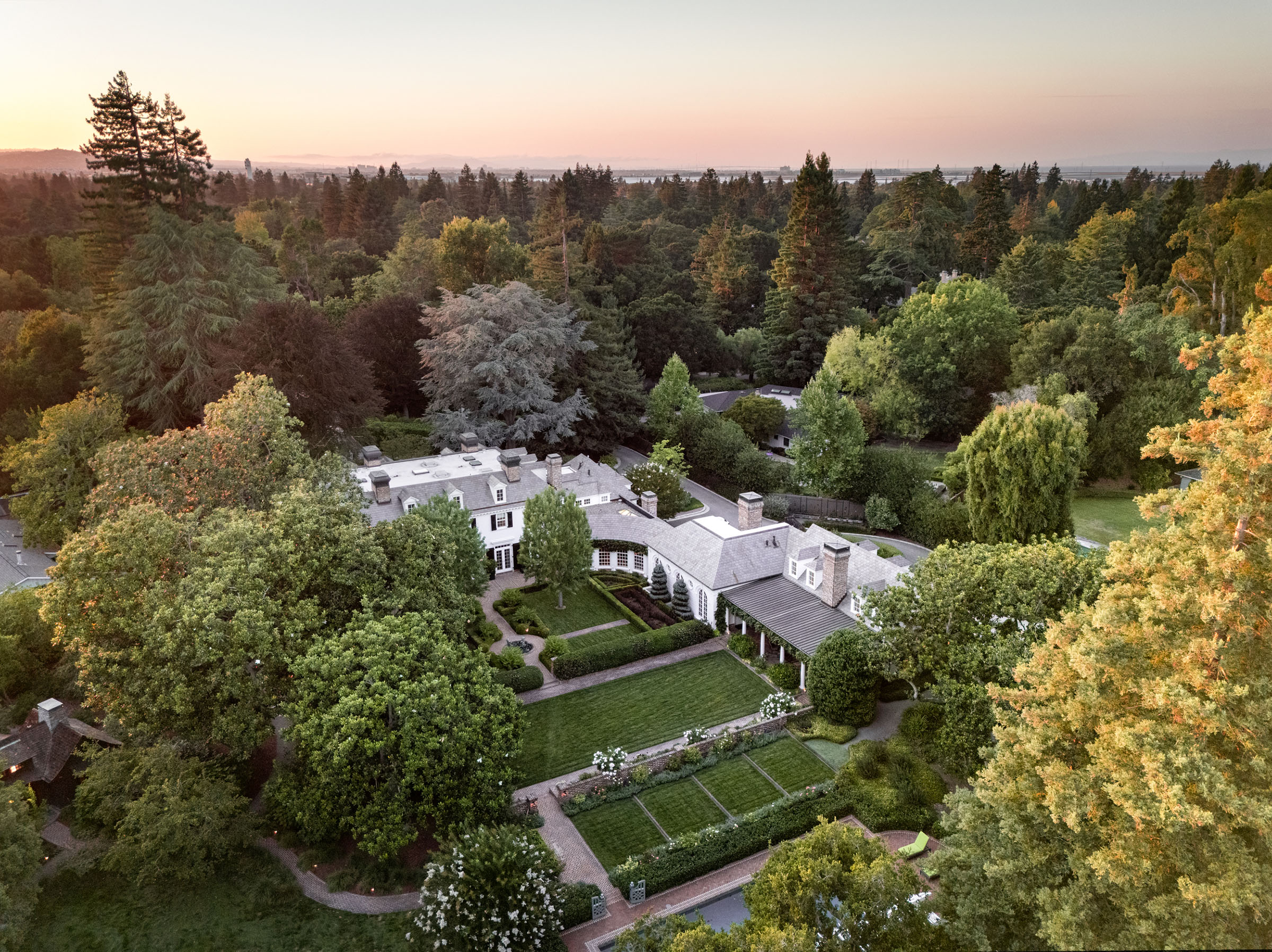 An aerial view of the house and gardens, looking towards San Francisco Bay. The property, which sits on 2.5 acres, the largest parcel in Lindenwood, is available via Christie's International Real Estate