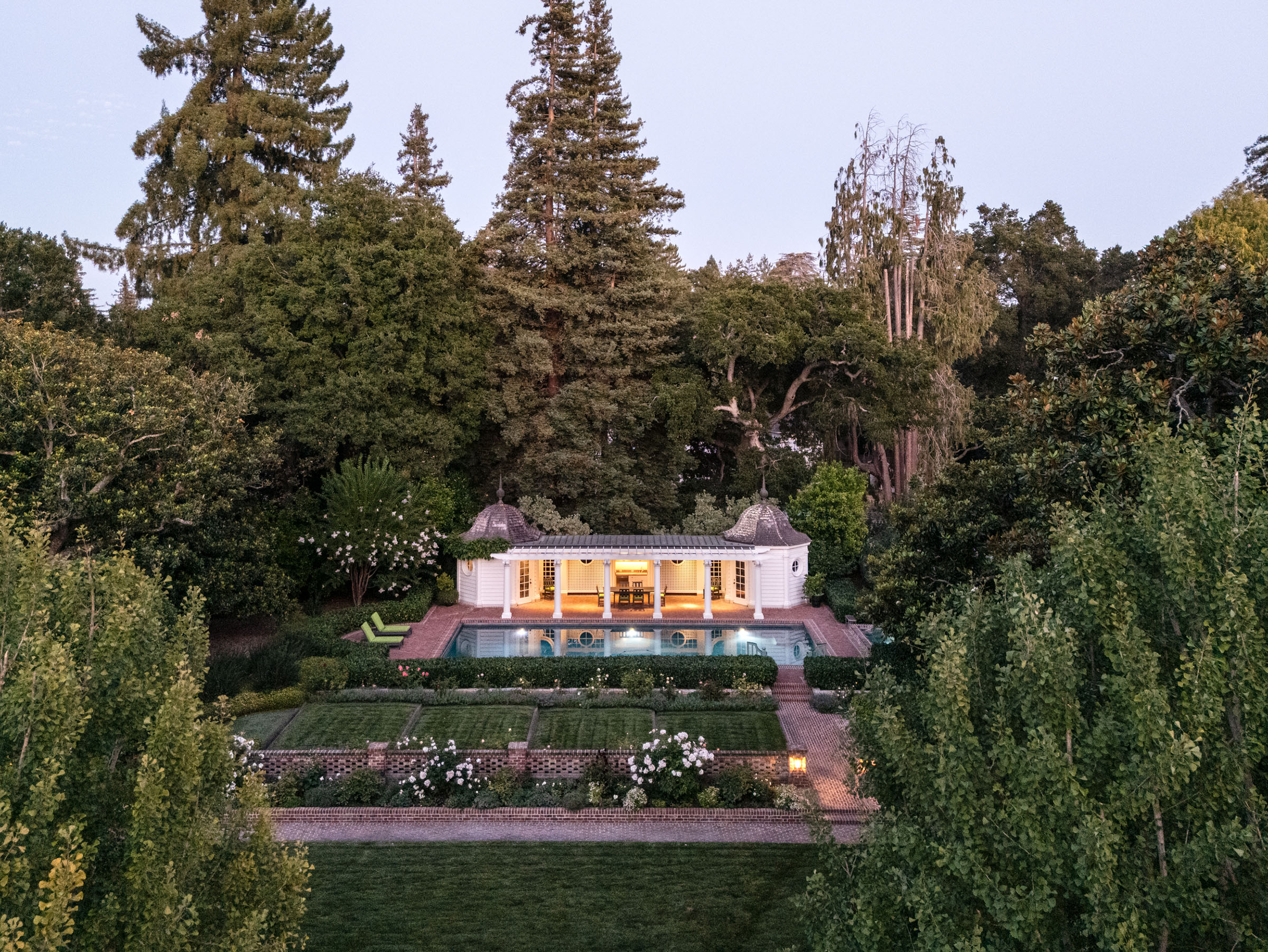 The pool house, with its shady terrace and domed octagonal pavilions at either end. The property is available via Christie's International Real Estate