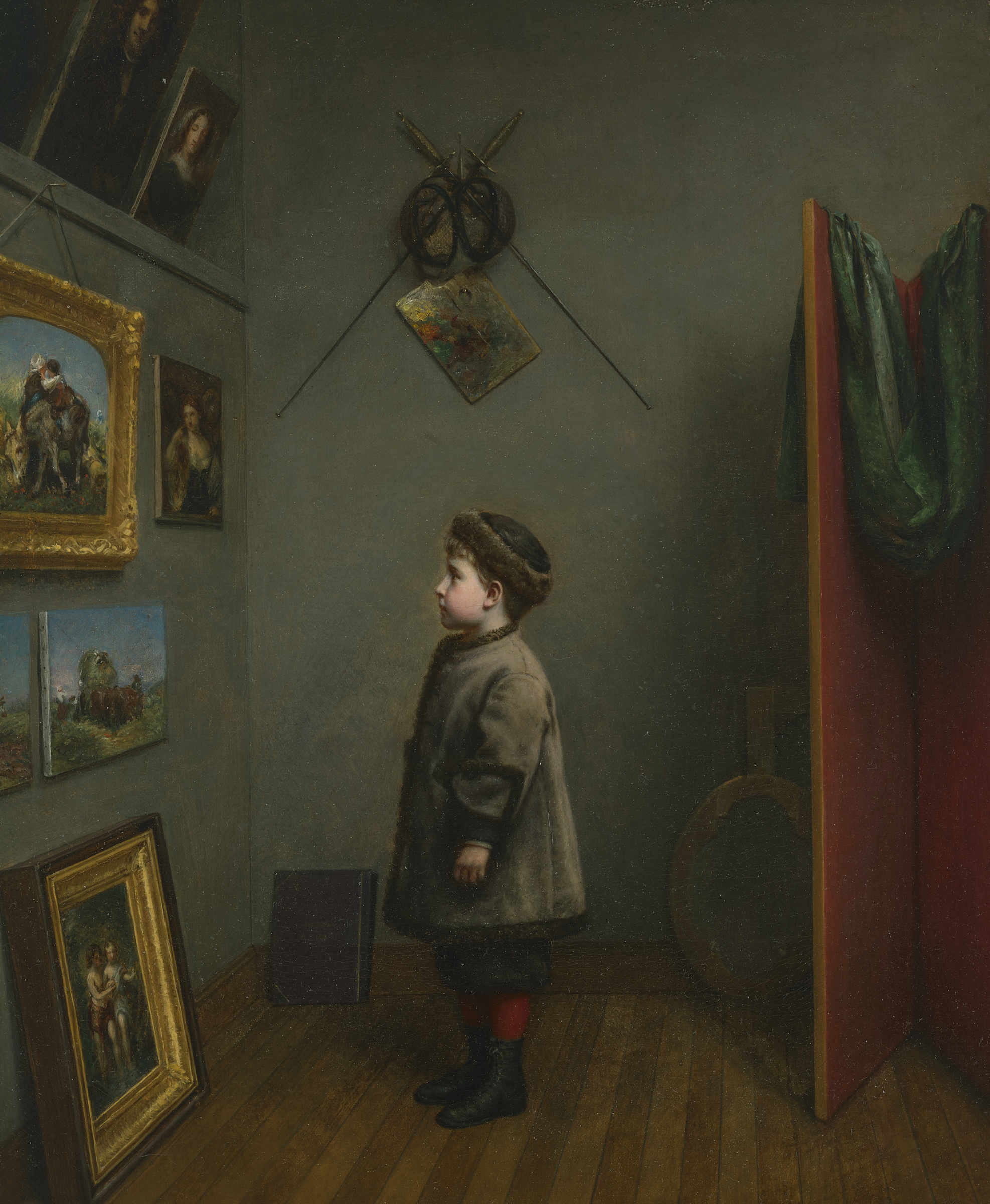 A child in a thick coat stands in an art gallery, observing paintings on the wall.