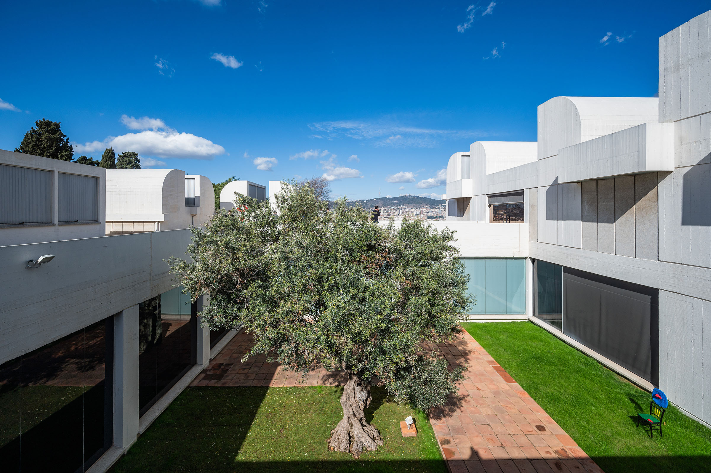 Miro's 1967 painted bronze Femme assise et enfant (Seated woman and child) in the Olive Tree Patio at the heart of the Fundacio Joan Miro. The artist envisaged the institution as 'a living place, without pretensions to monumentality: human, with a great variety of spaces'