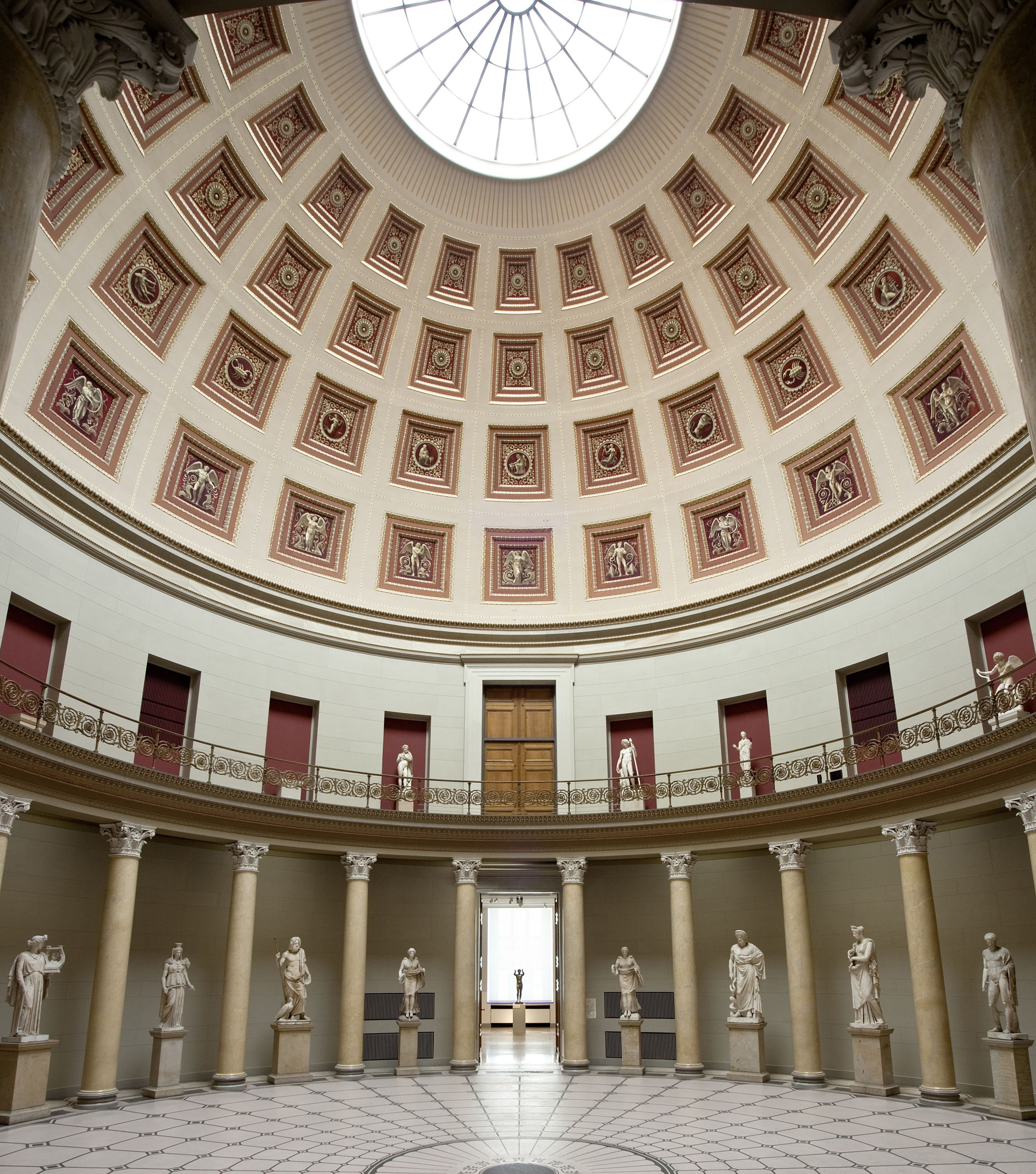 Classical statuary in the grand entrance rotunda of the Altes Museum, designed by Karl Friedrich Schinkel. The colonnaded space with its magnificent coffered dome was inspired by the Pantheon in Rome