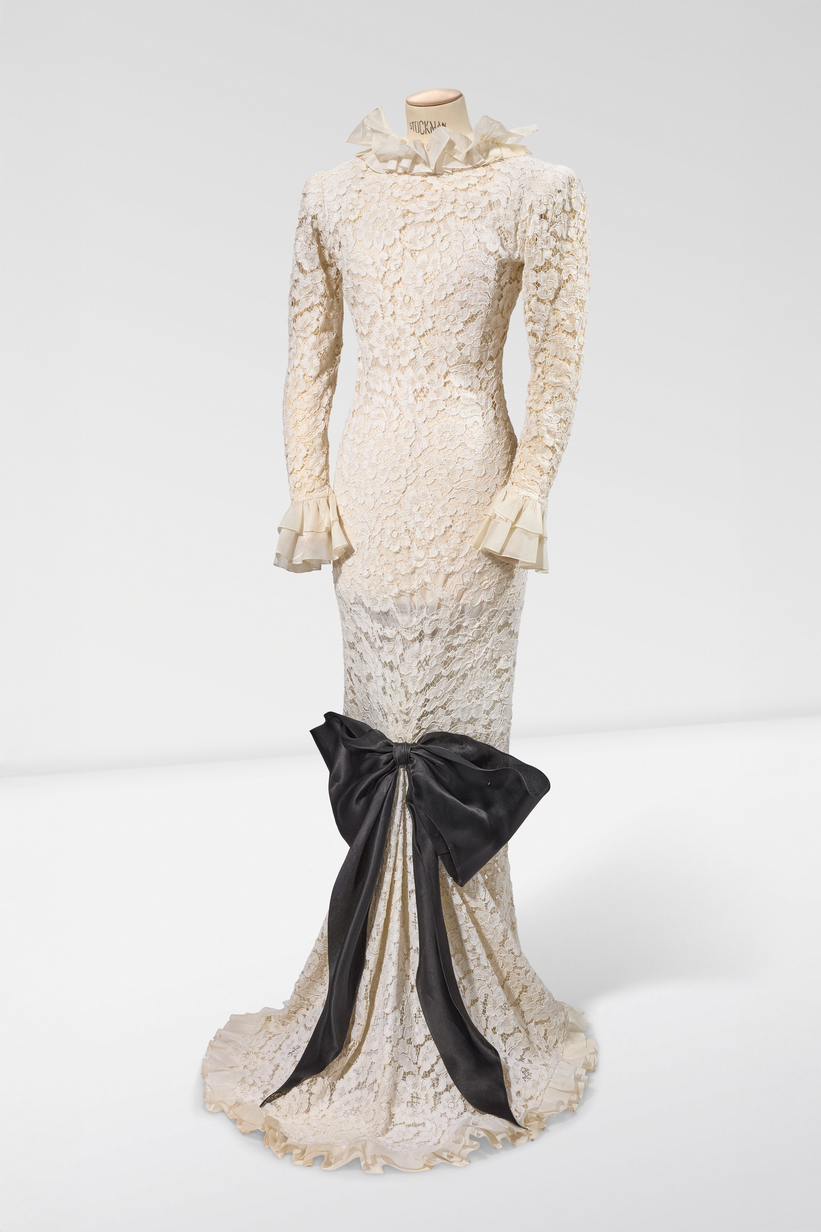 Yves Saint Laurent, A long white lace evening dress with black gazar bow, haute couture Fall-Winter 1993-94, offered in Mathilde and Friends in Paris, 26 January to 4 February 2026 at Christie's Online