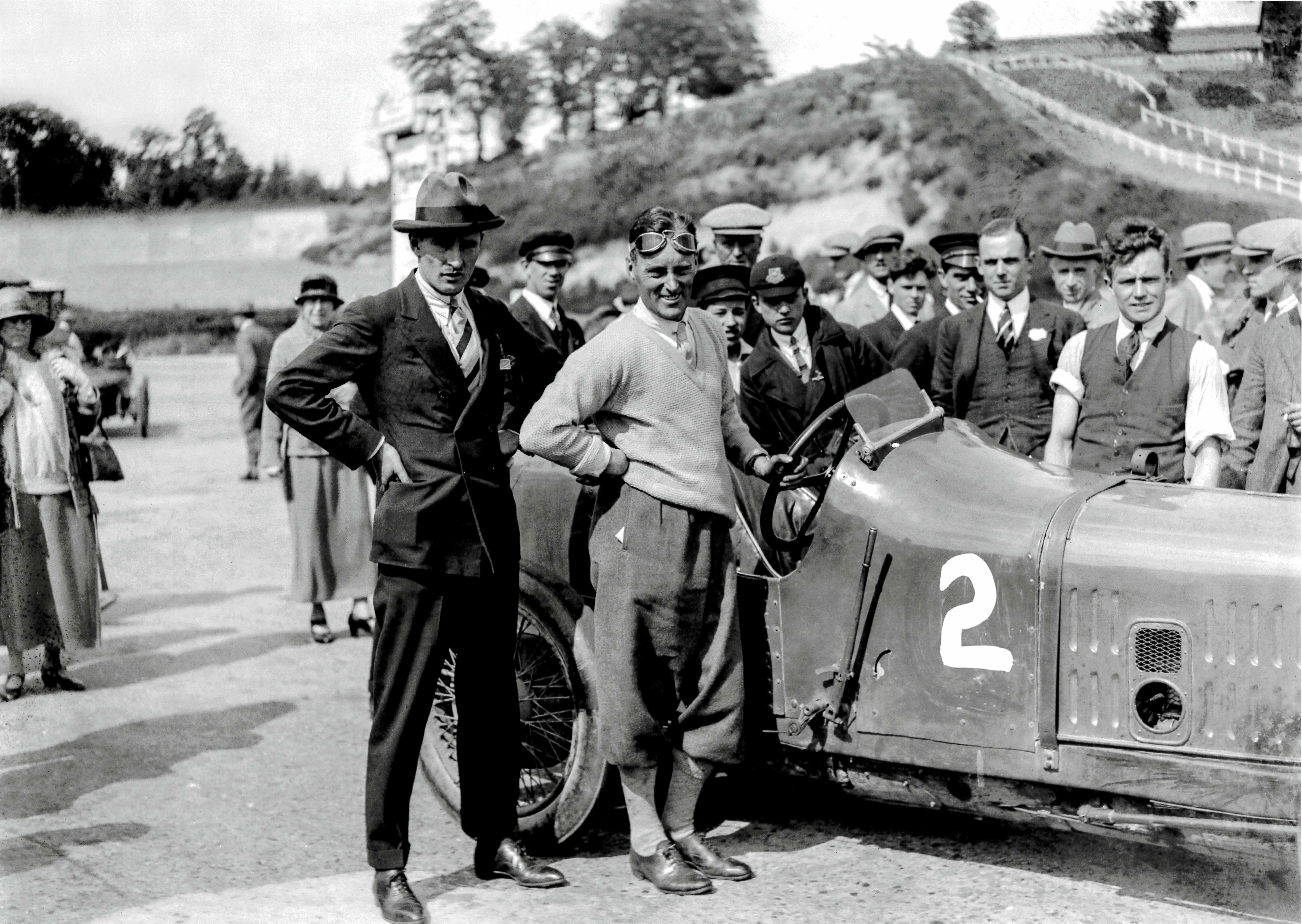 Racing motorist Malcolm Campbell, having recently purchased the 1920 Ballot 3/8 LC Grand Prix Two-Seater, at Brooklands in 1924. He painted it in his signature Saxe Blue, making it one of his earliest 'Blue Bird' cars. Campbell went on to break numerous land and water speed records in Blue Birds