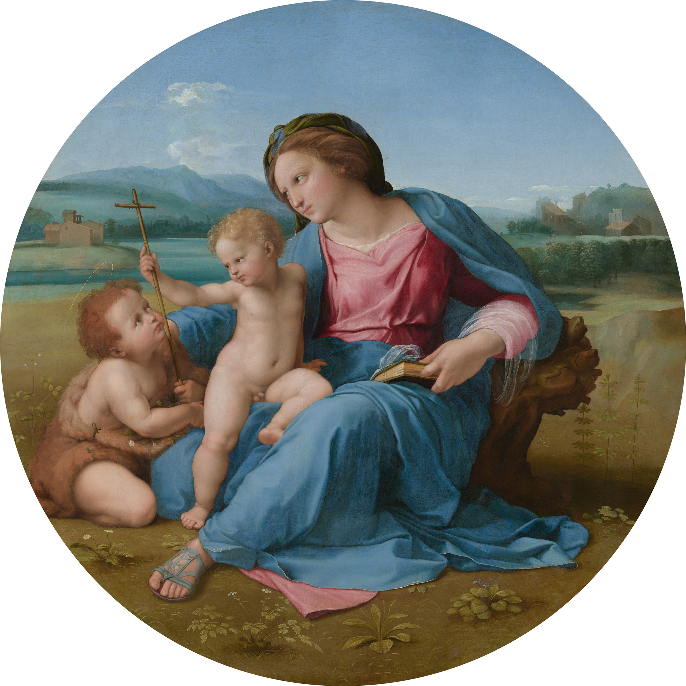 A woman in a blue and pink dress sits outdoors with two small children, one holding a cross.