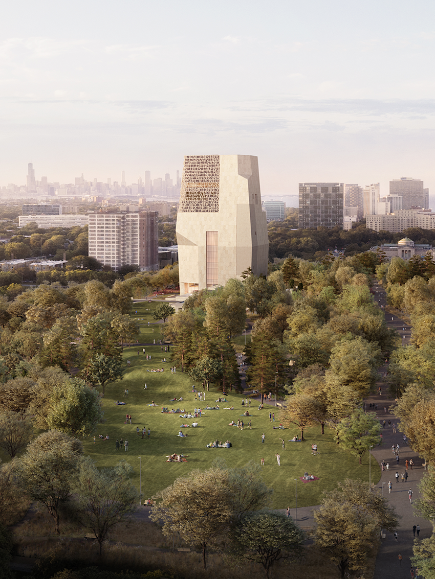 A modern building stands in a park surrounded by trees with people relaxing on the grass.