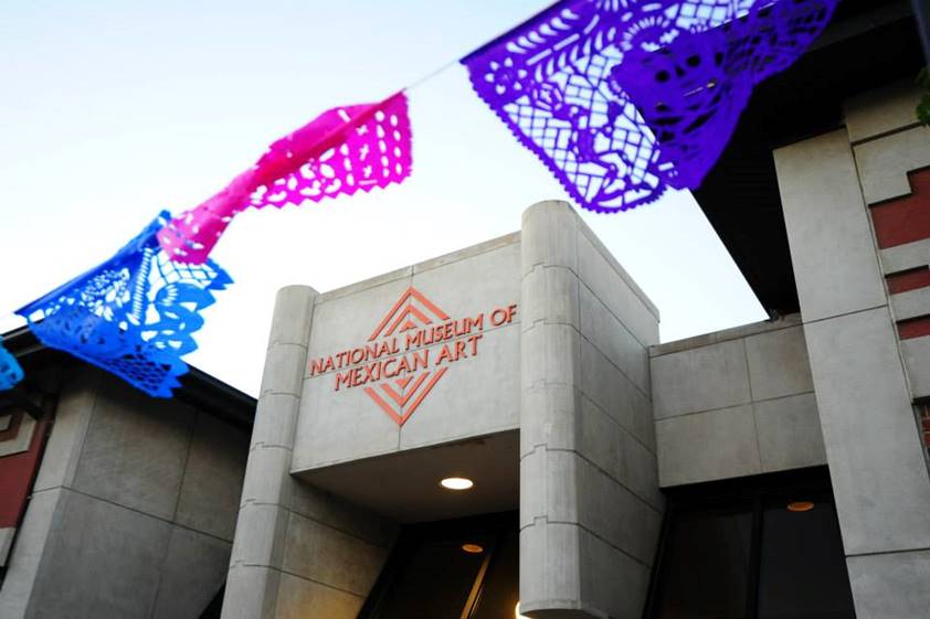 The National Museum of Mexican Art building with colorful papel picado hanging above.