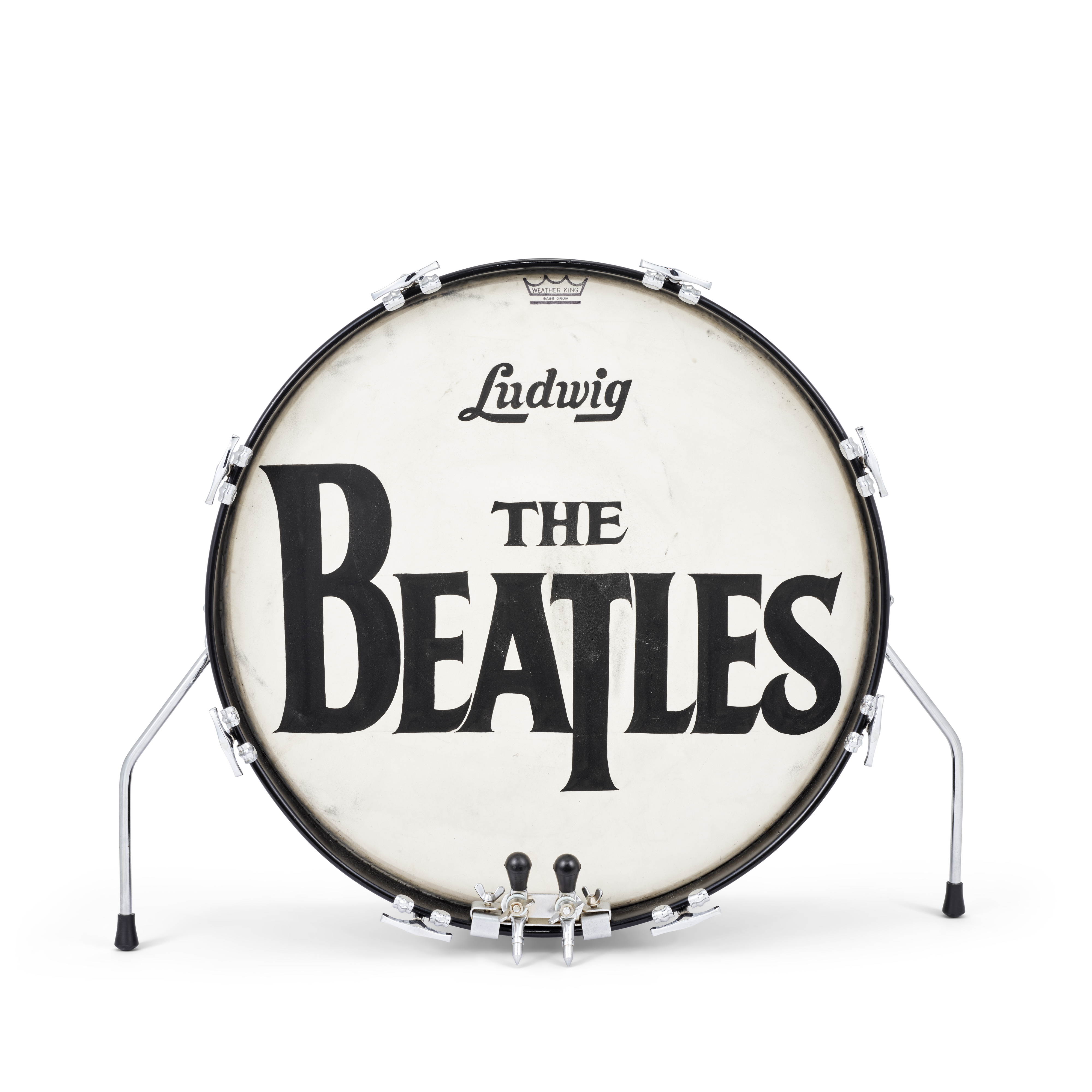 A drum with "Ludwig" and "The Beatles" written on its front head is shown.