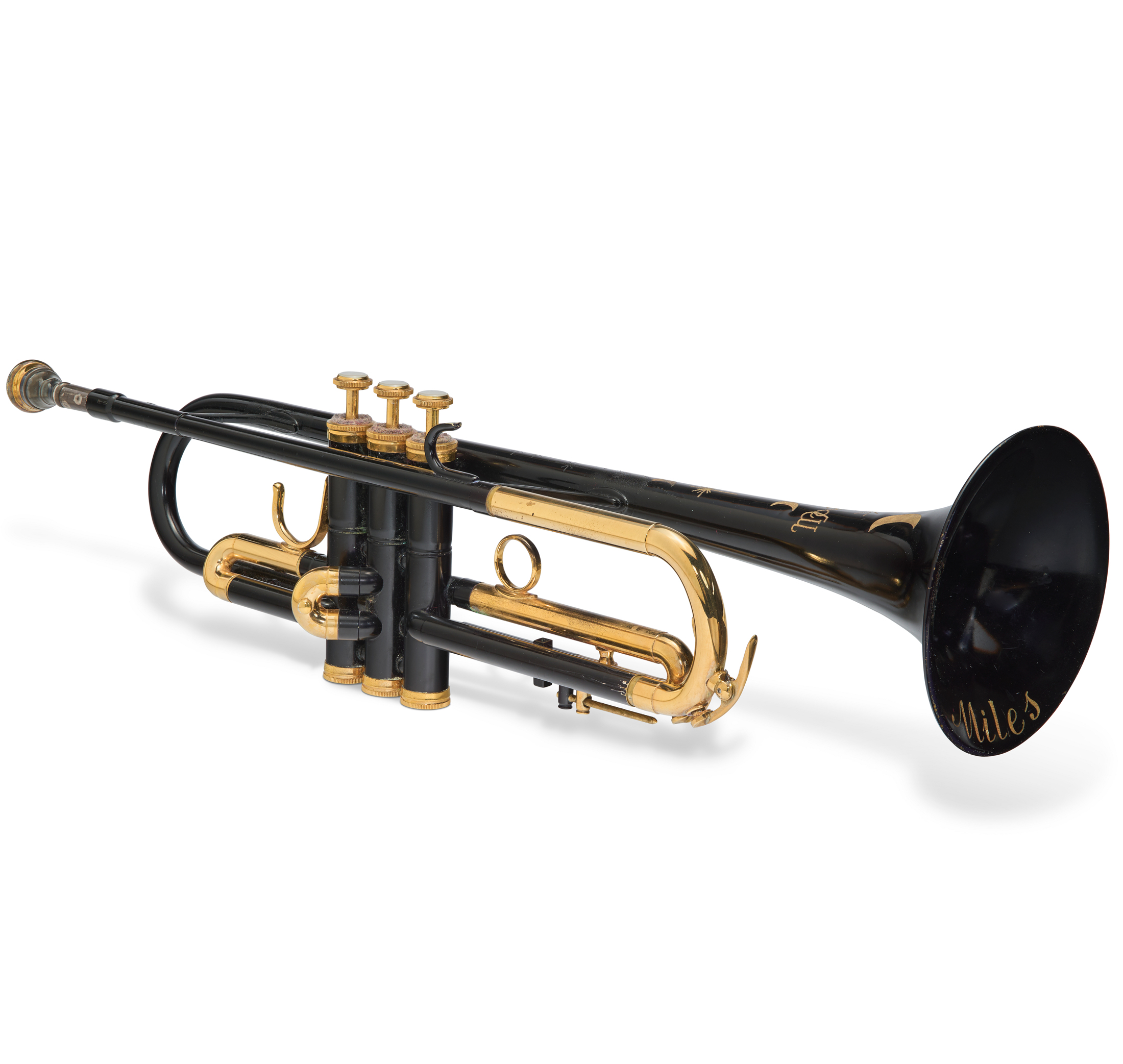 A black and gold trumpet with "Miles" written on the bell.