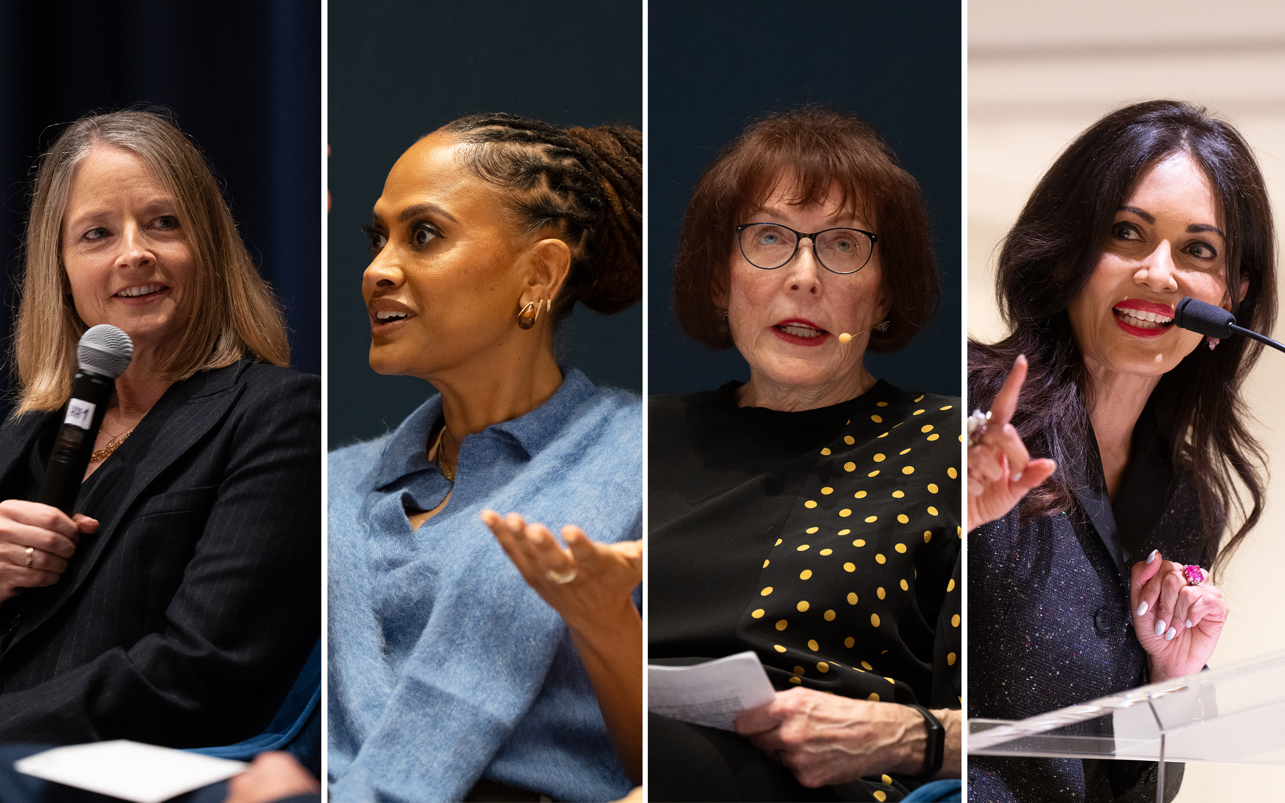 Four women are speaking or presenting while seated and standing at an event or panel discussion.