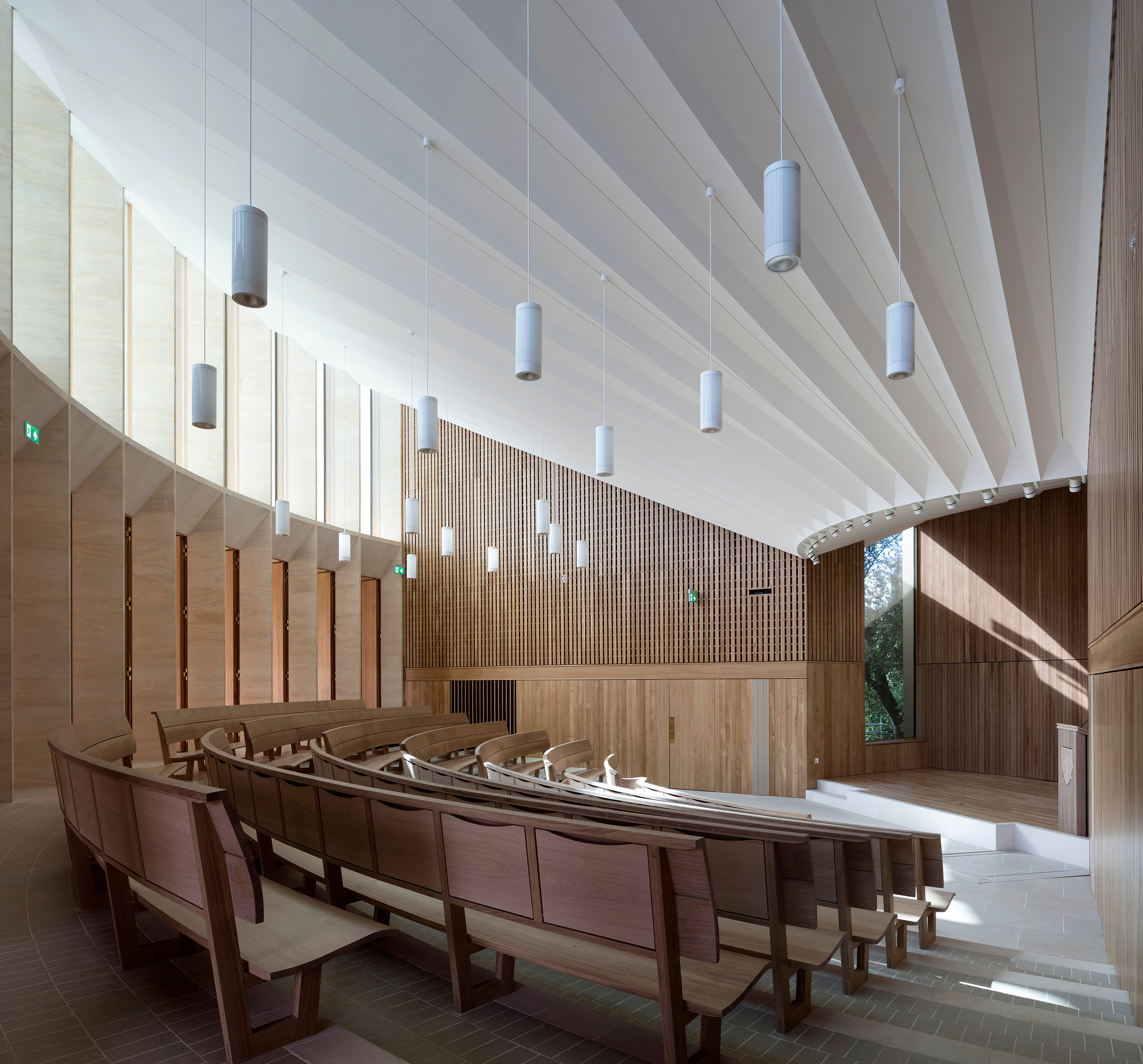 In 2015, Benchmark used steam-bent European oak to make curved auditorium seating at Worcester College, Oxford