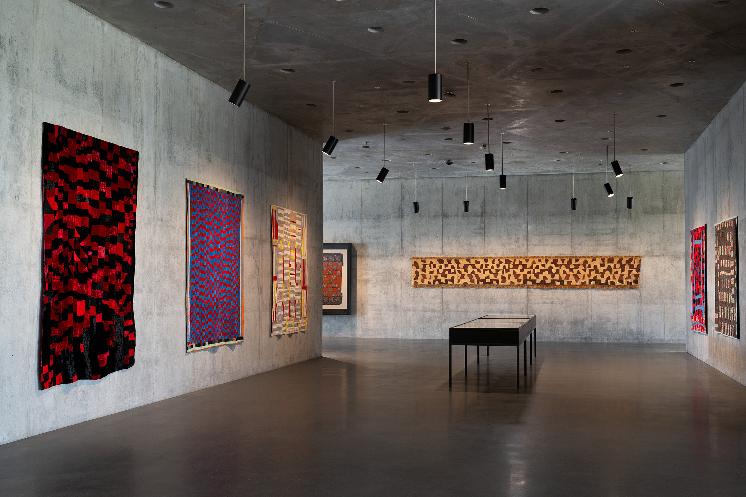 Installation view of the inaugural presentation in the David Geffen Galleries. On the wall to the left are three African-American quilts: Rosie Lee Tompkins, Hit and Miss Strip, 1983; Mary Lue Brown, Hit and Miss, circa 1945; and Effie Jackson, Double Strip, early 1940s