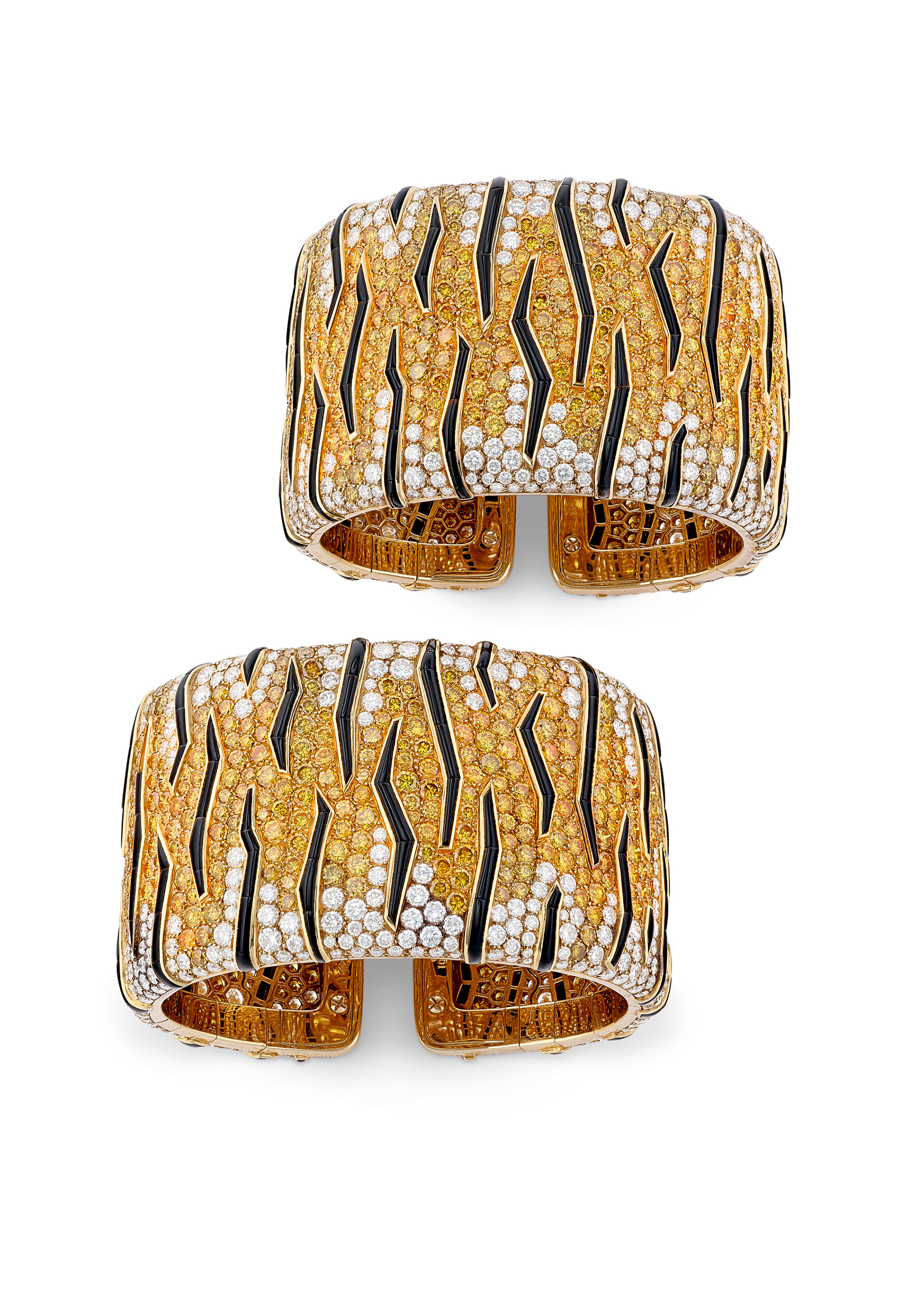 A pair of Cartier coloured diamond, diamond and onyx Tiger cuffs, offered in Magnificent Jewels on 13 May 2026 at Christie's in Geneva