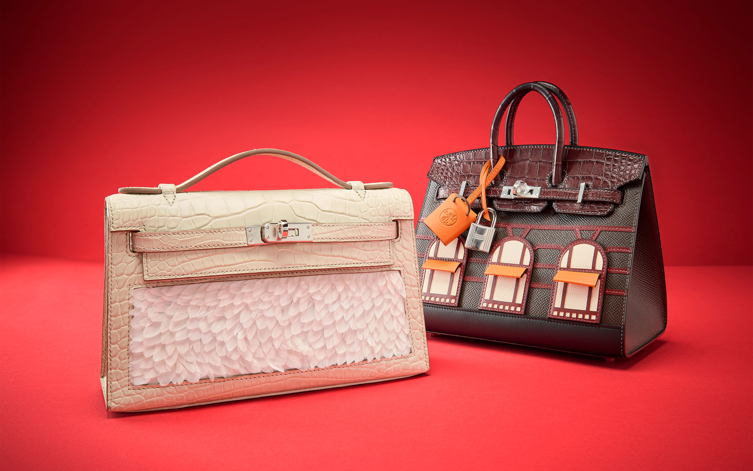 Left, a special-order matte Beton alligator and feathers Kelly Pochette with palladium hardware, Hermes, 2023, and a limited-edition matte Rouge Sellier alligator, ebene Epsom, Rouge H Swift, Orange H Swift, ebene Sombrero and Craie Swift leather Faubourg Rainy Day Sellier Birkin 20 with palladium hardware, Hermes, 2024. Both offered in Handbags Online: The Paris Edit, until 24 June 2026 at Christie's Online