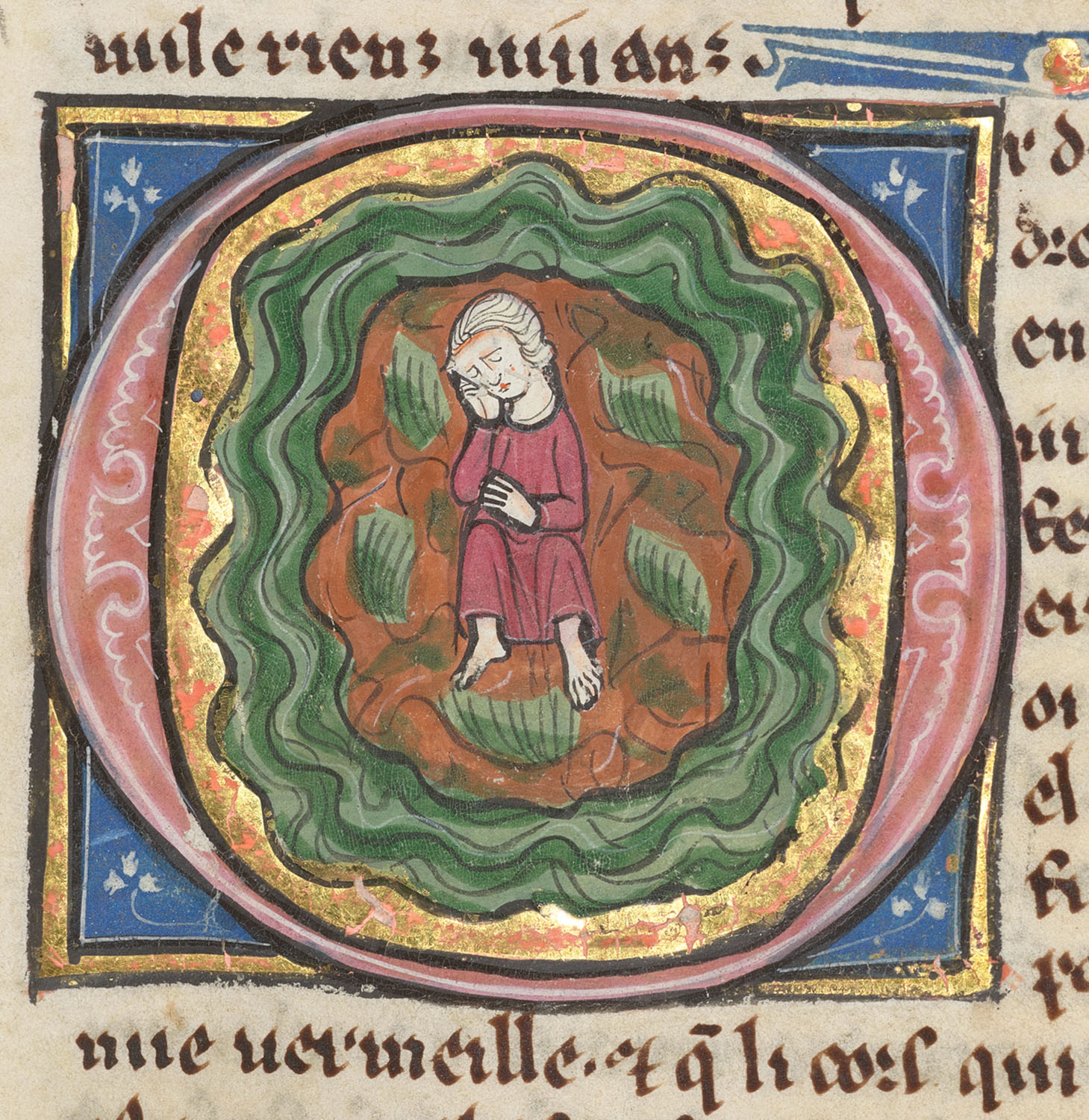 In another initial O, Nascien is pictured asleep, having been miraculously freed from prison and transported to the Turning Island