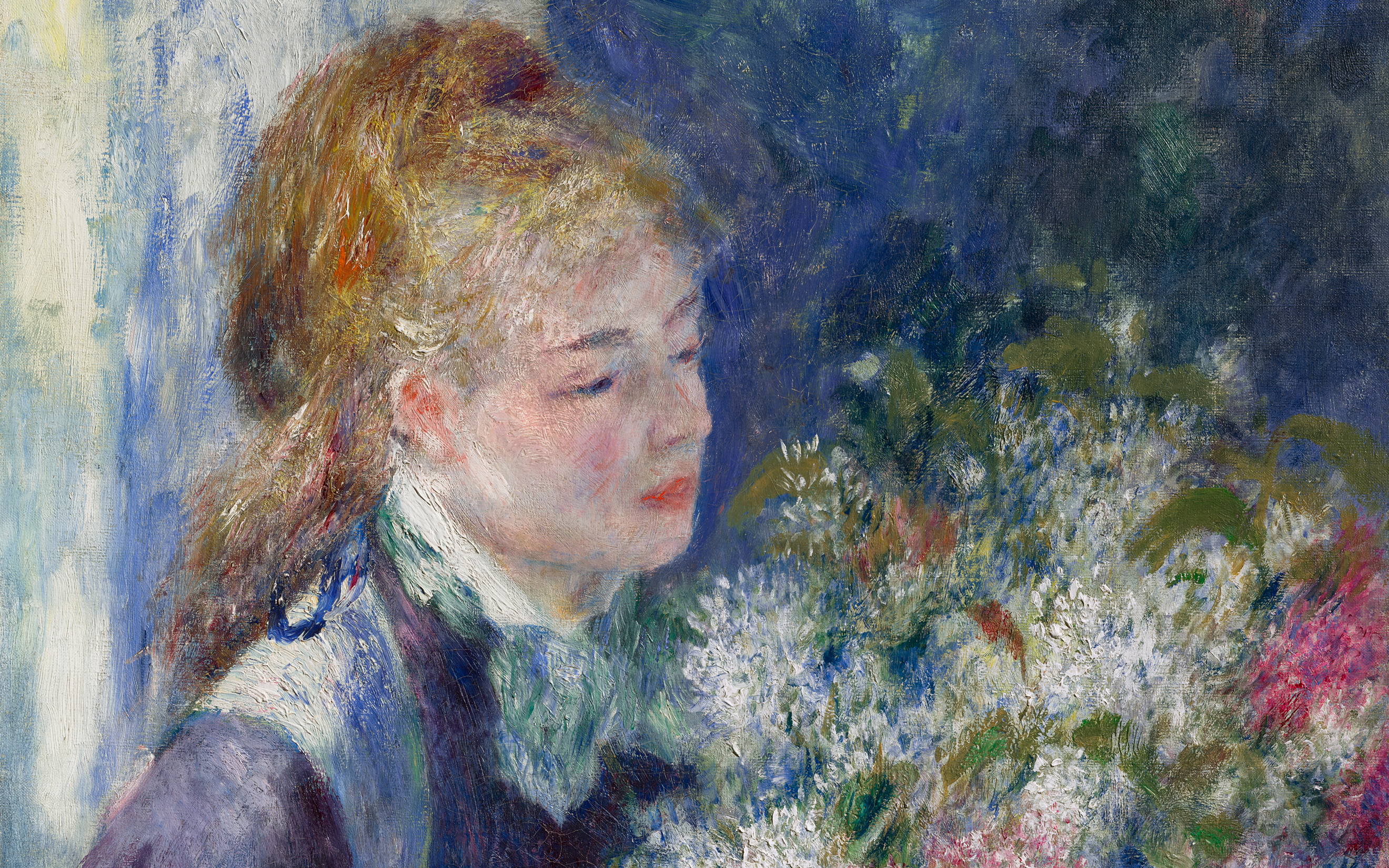 A person with brown hair stands next to a large colorful bouquet of flowers.