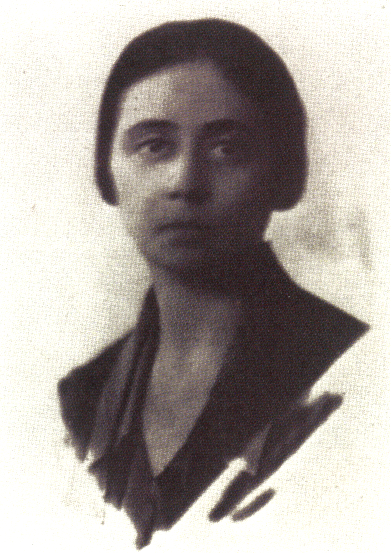 A black and white portrait of a person with their face blurred or obscured.