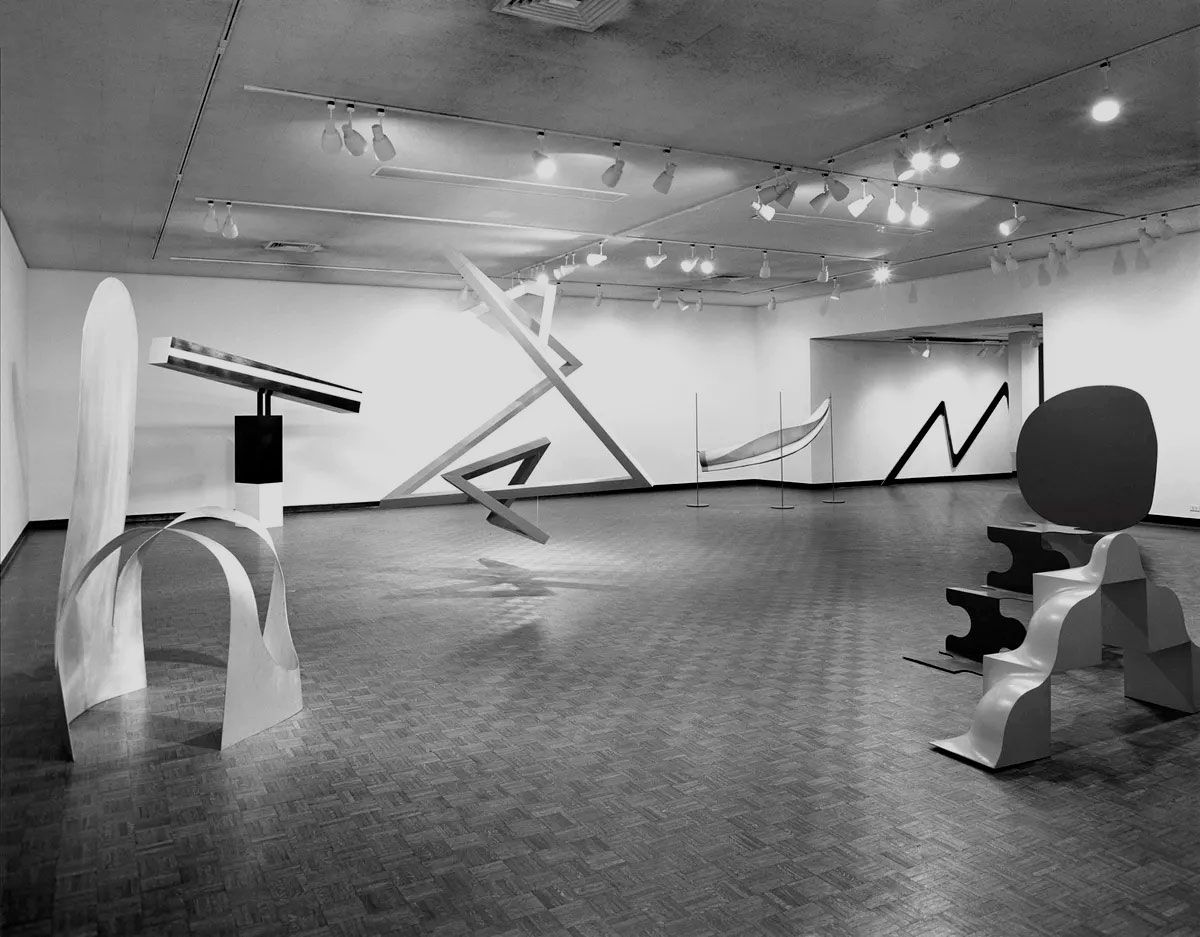 A modern art gallery with abstract geometric sculptures and minimalist installations.