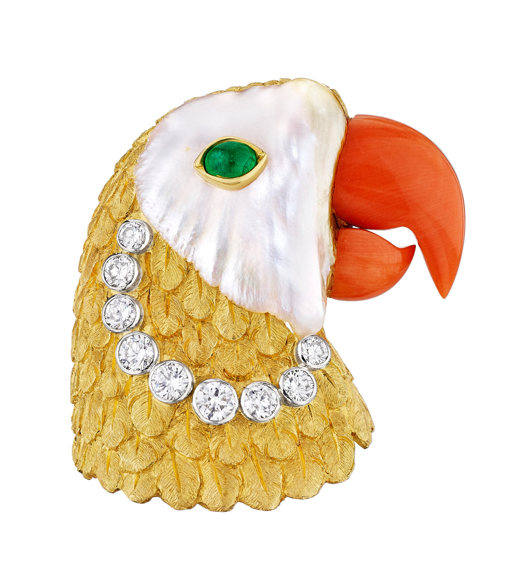 A jeweled parrot brooch with a gold body, diamond accents, pearl, emerald eye, and coral beak.