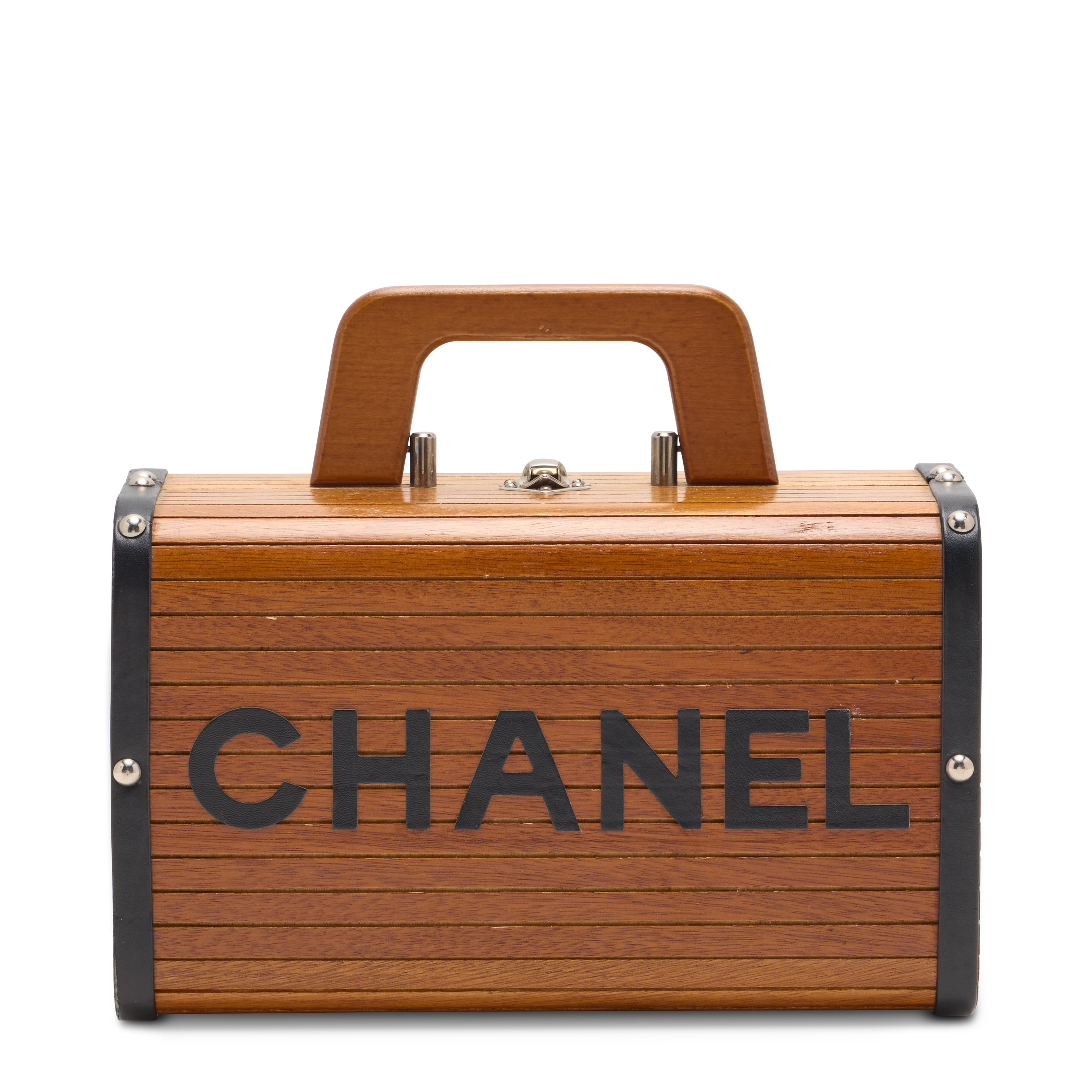 A brown wood vanity case, Chanel, circa 1994. Estimate: HK$30,000-40,000. Offered in Handbags Online: the Hong Kong edit, until 14 July at Christie’s Online 
