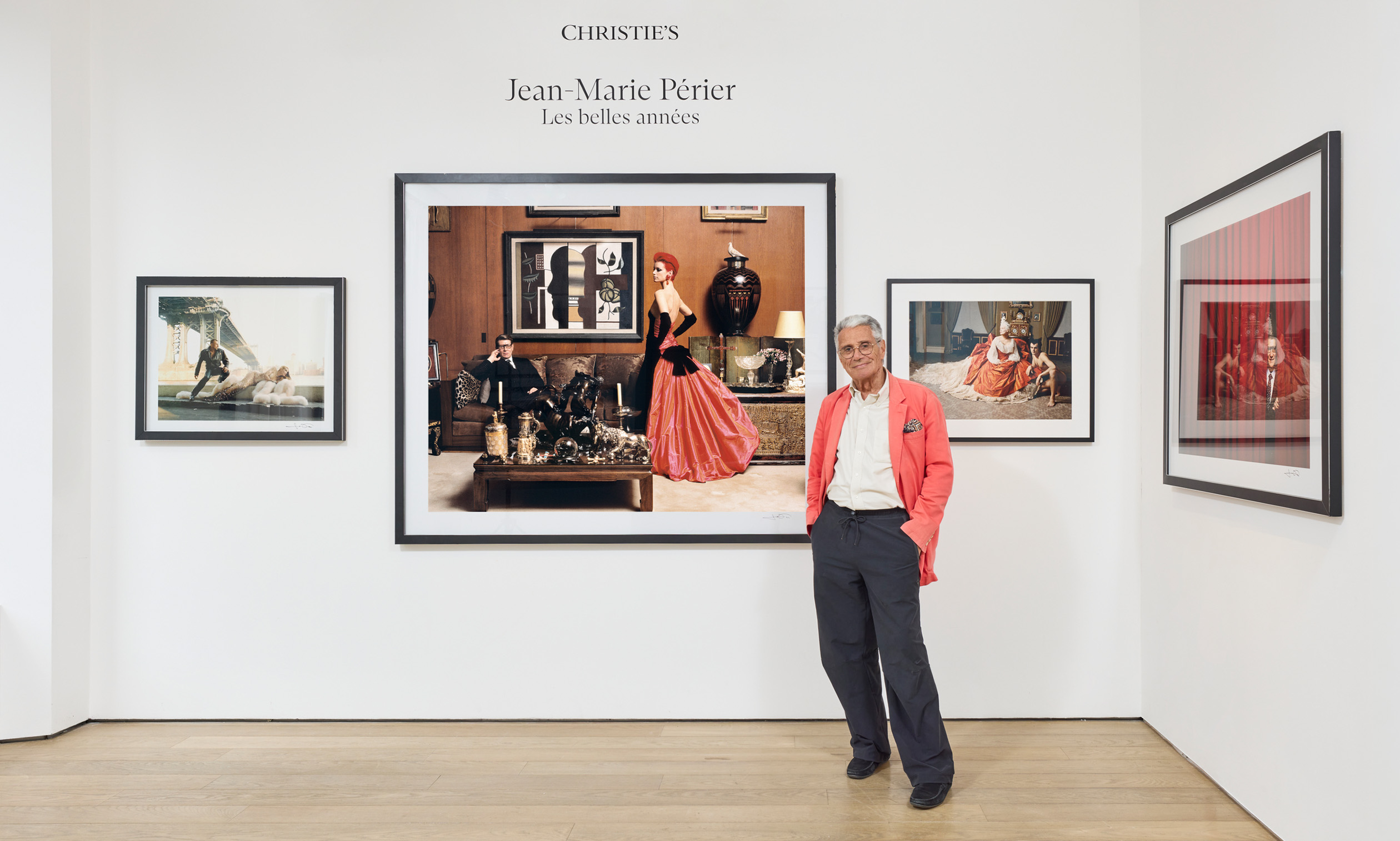 The photographer at his exhibition, Jean‑Marie Perier: Les belles annees, at Christie's in Paris. His works, from left: Thierry Mugler and Jerry Hall, New York, July 1995; Yves Saint Laurent and Sibyl Buck, Paris, October 1995; Vivienne Westwood and her partner, London, March 1994; Yves Saint Laurent, Paris, October 1995