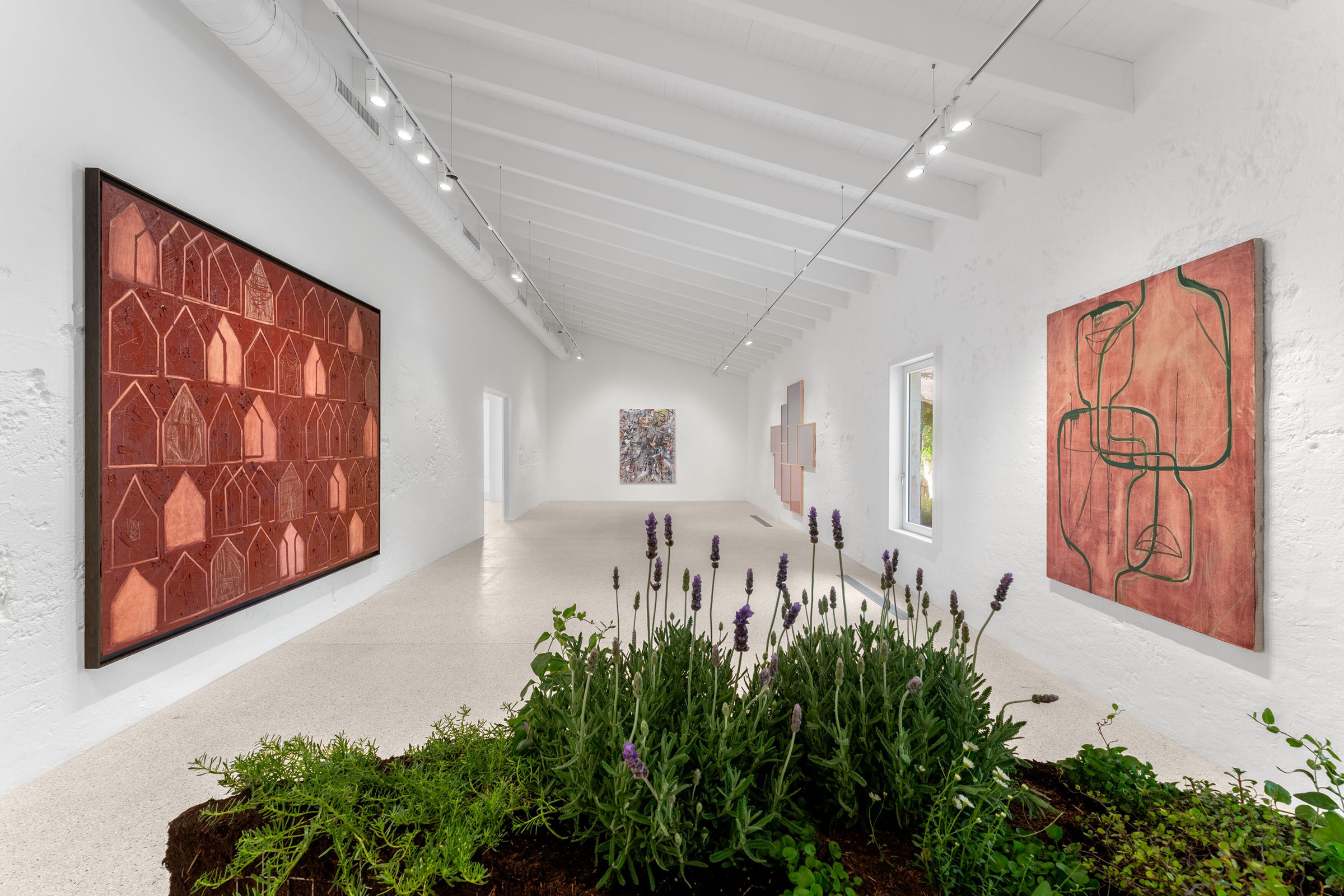 An installation view of Directionless at Hauser and Wirth Menorca, showing works by Rashid Johnson, Julie Mehretu and Leslie Hewitt