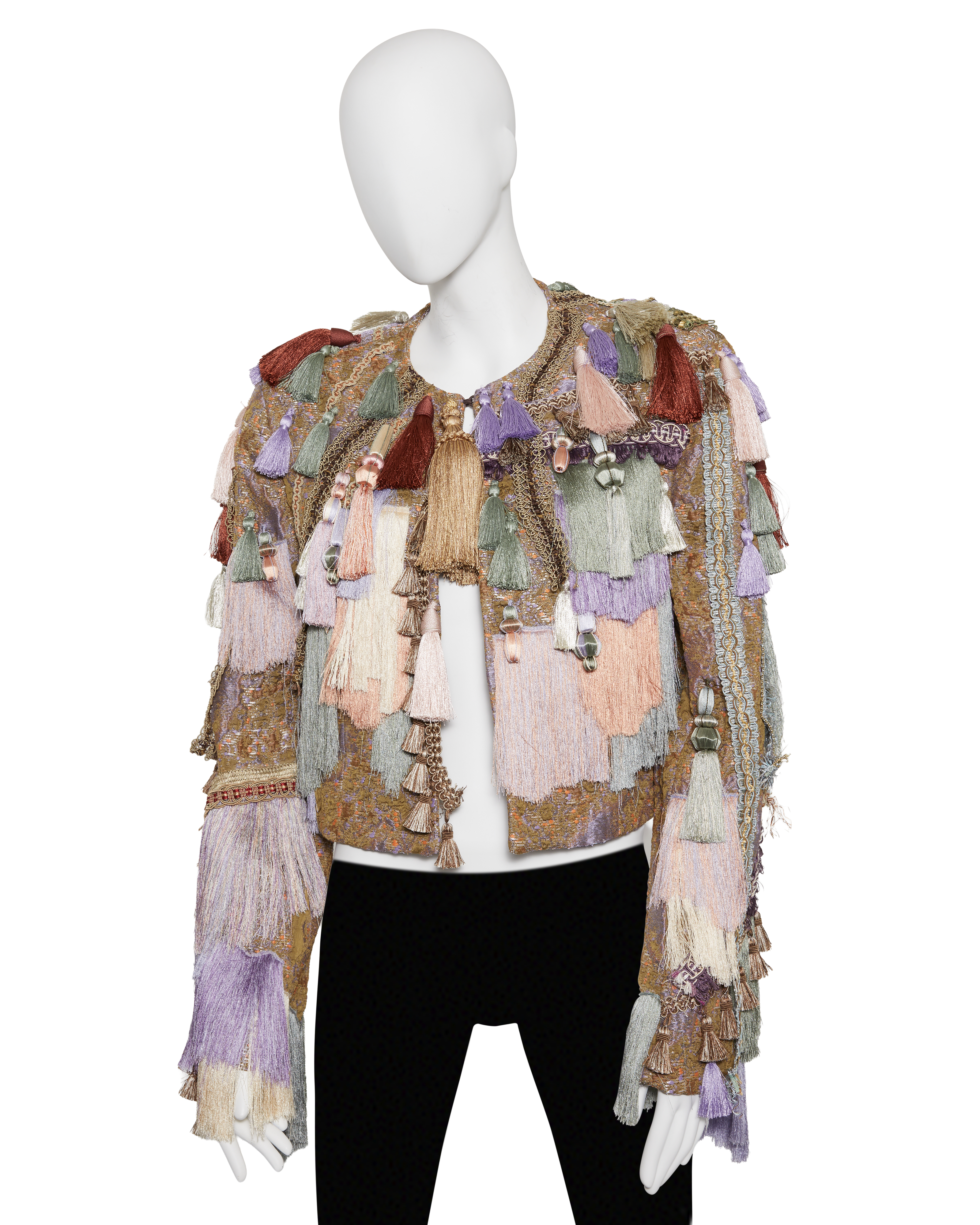 A mannequin displays a colorful jacket adorned with multiple large tassels in various pastel shades.