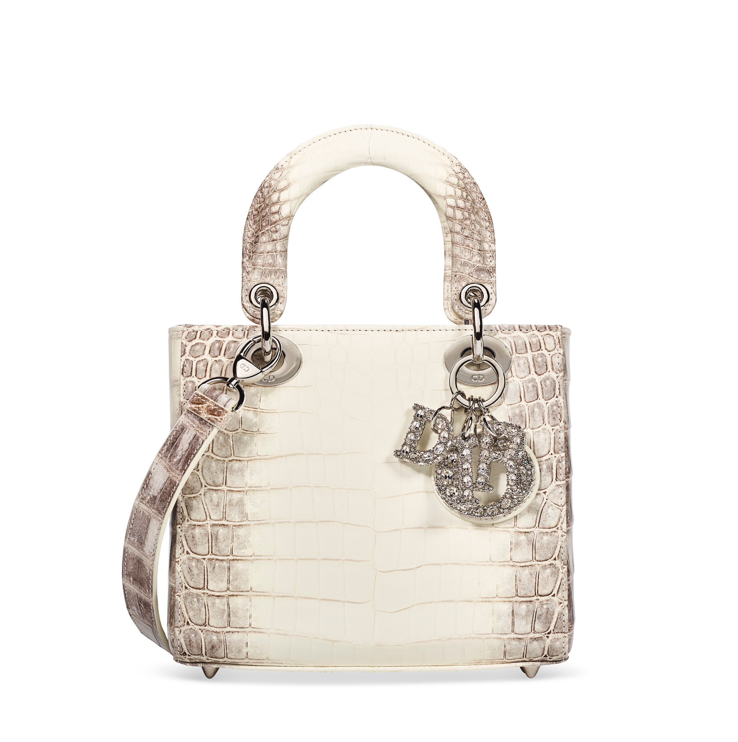 A luxury white crocodile leather handbag with silver hardware and decorative letter charms.