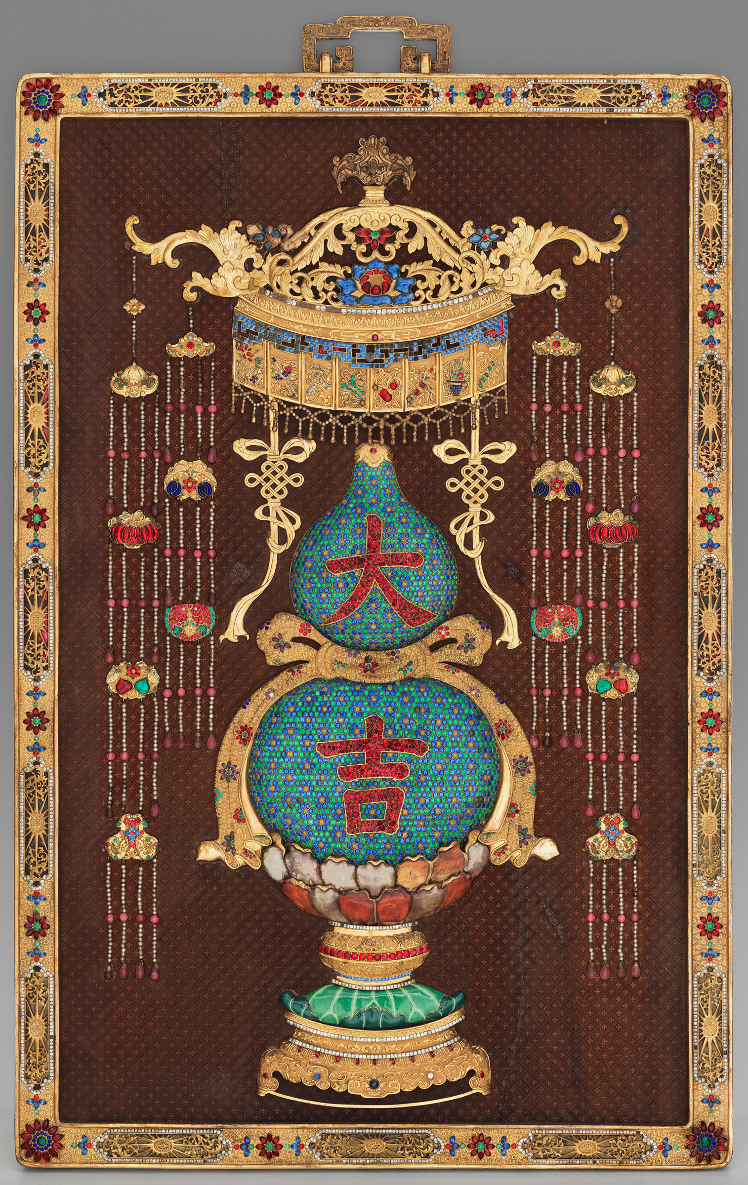 A colorful ornate Chinese artwork with intricate decorations and symbols on a brown background.