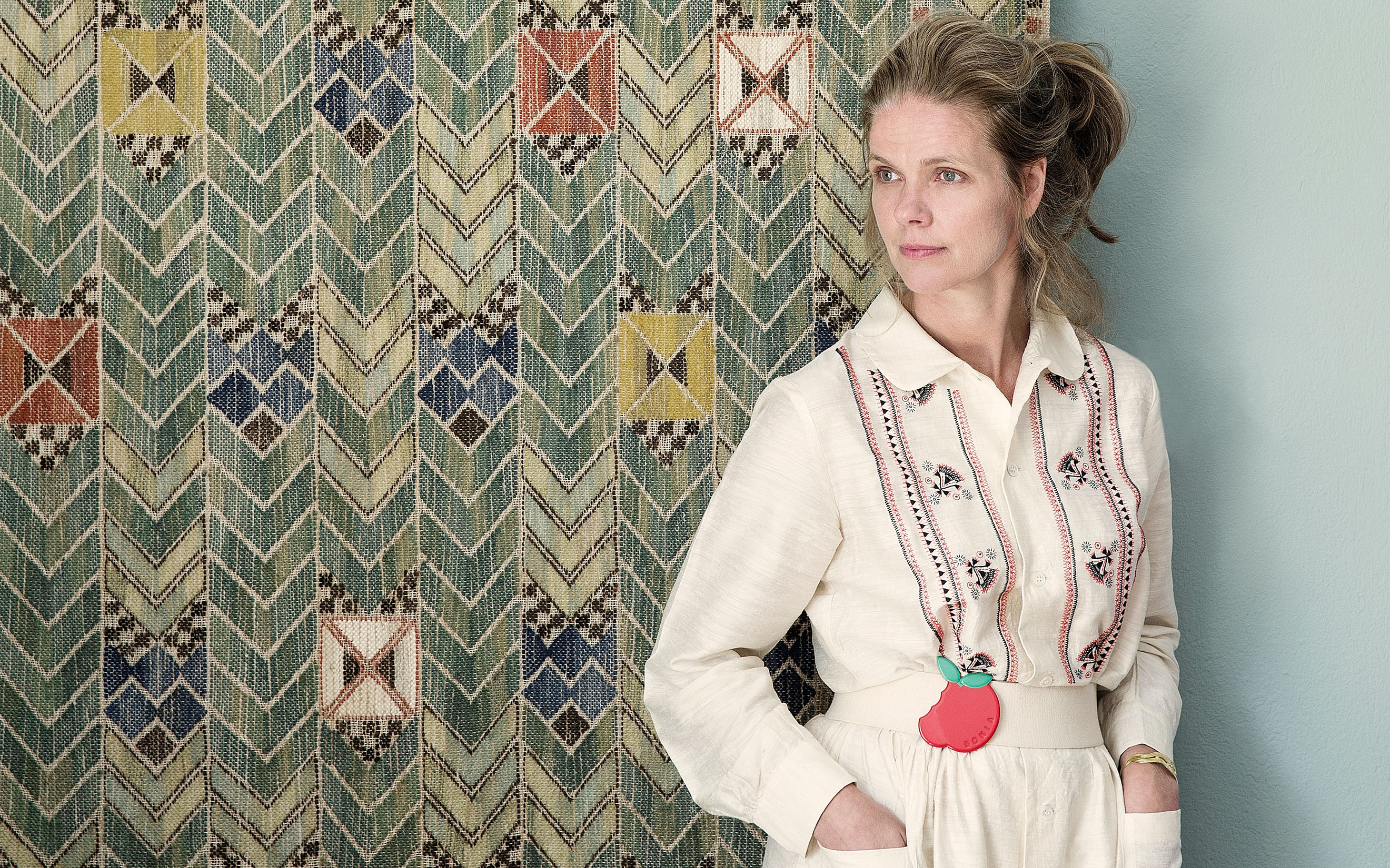 Tina Seidenfaden Busck at The Apartment in Copenhagen, with a tapestry by Marta Maas-Fjetterstrom