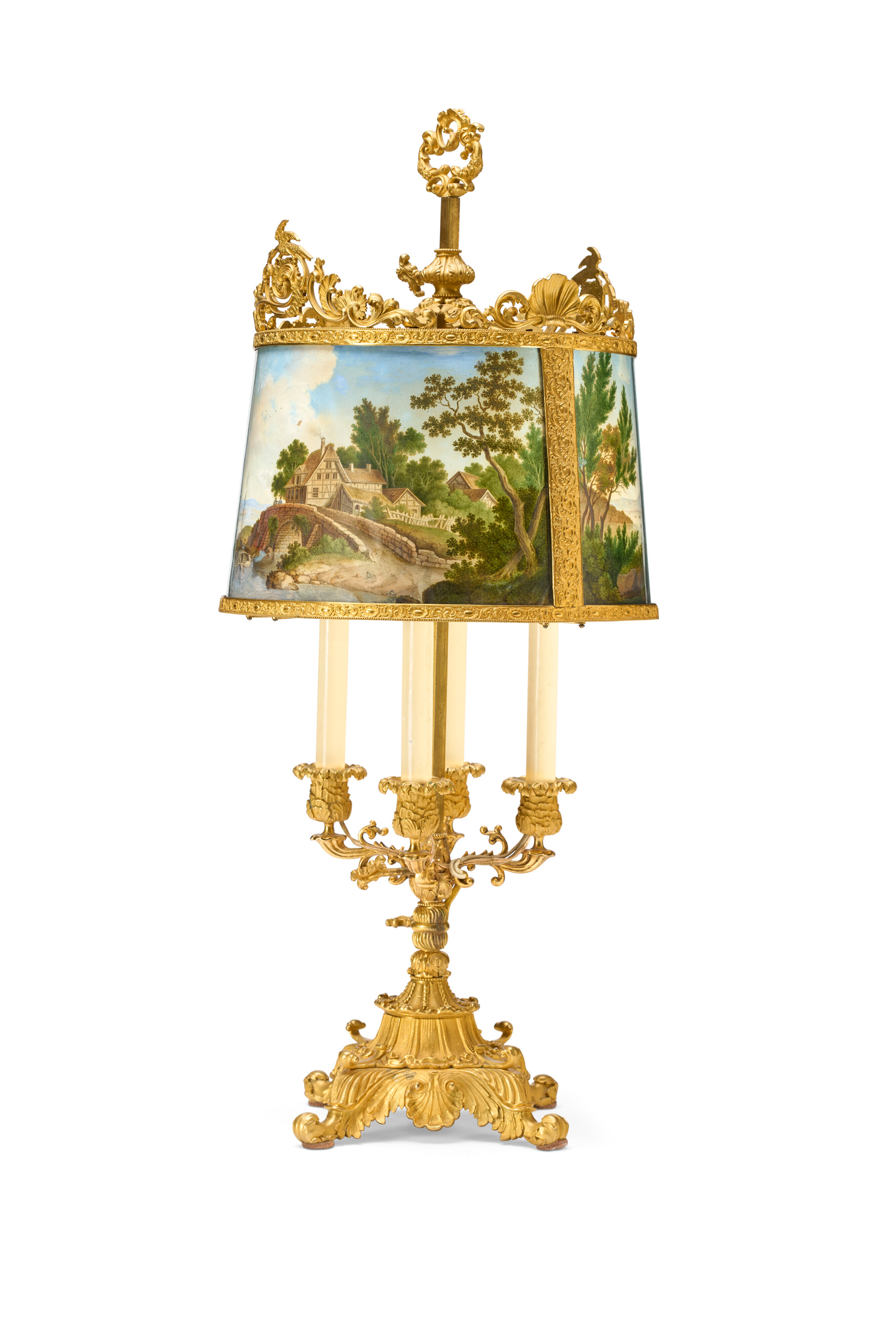 A decorative gold lamp with painted lampshade depicting a scenic landscape and ornate details.