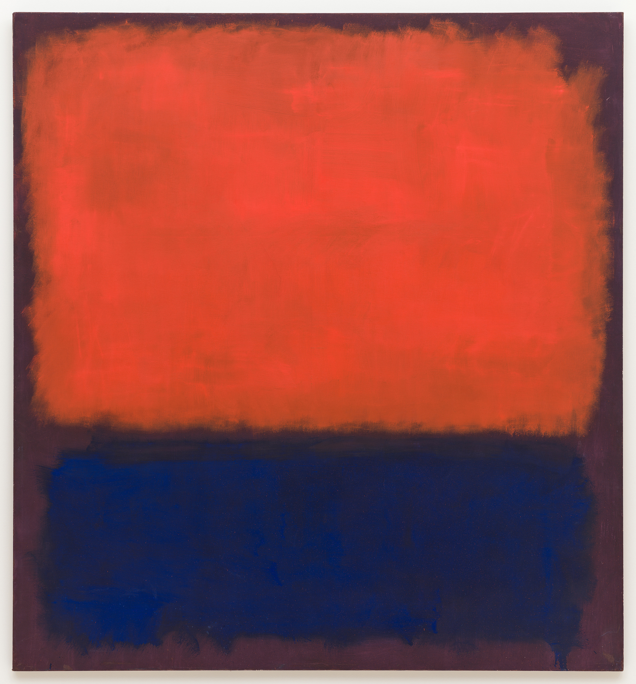 The image shows an abstract painting with a large red rectangle above a large dark blue rectangle.