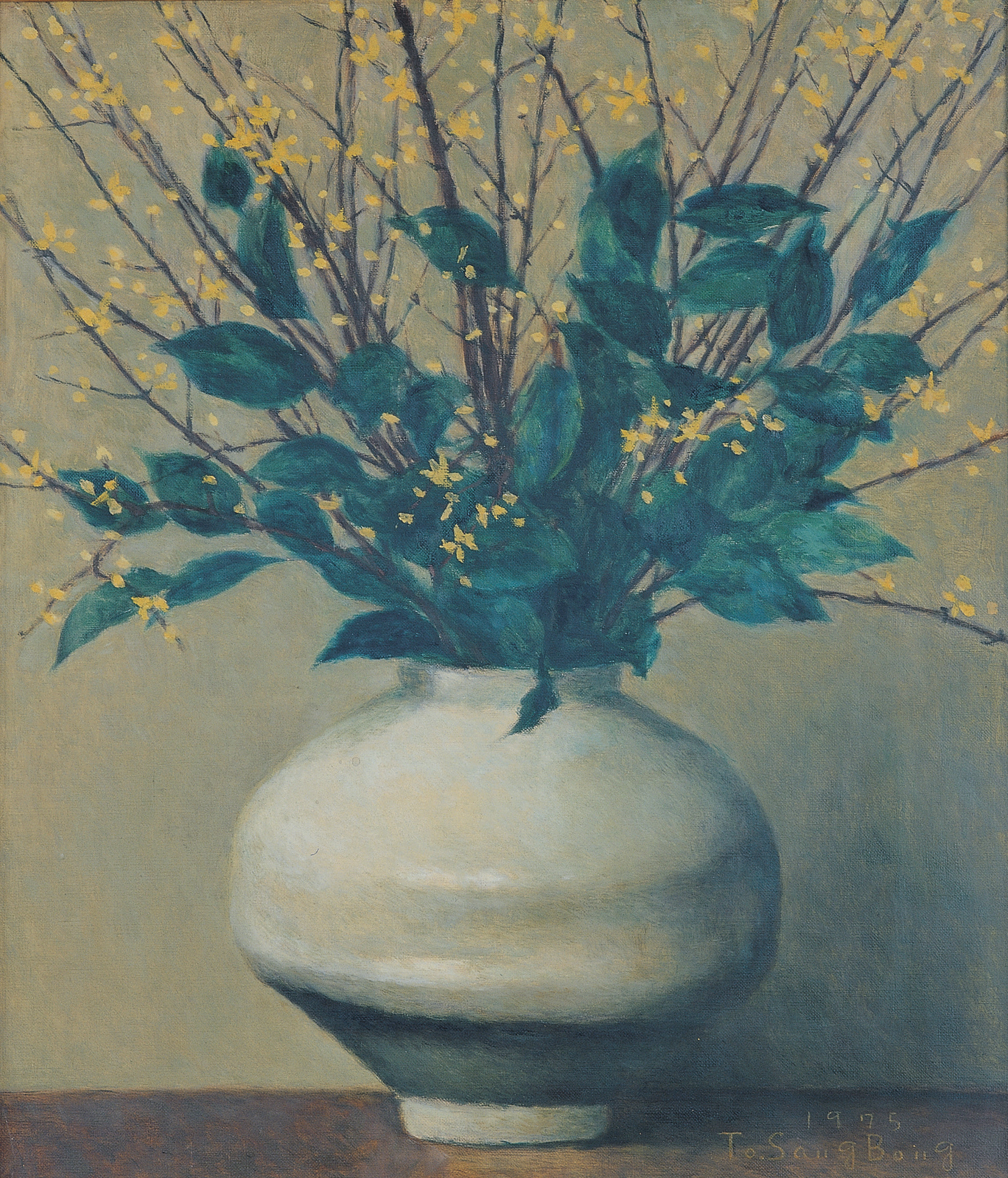 A white vase holds leafy branches with small yellow flowers against a muted background.