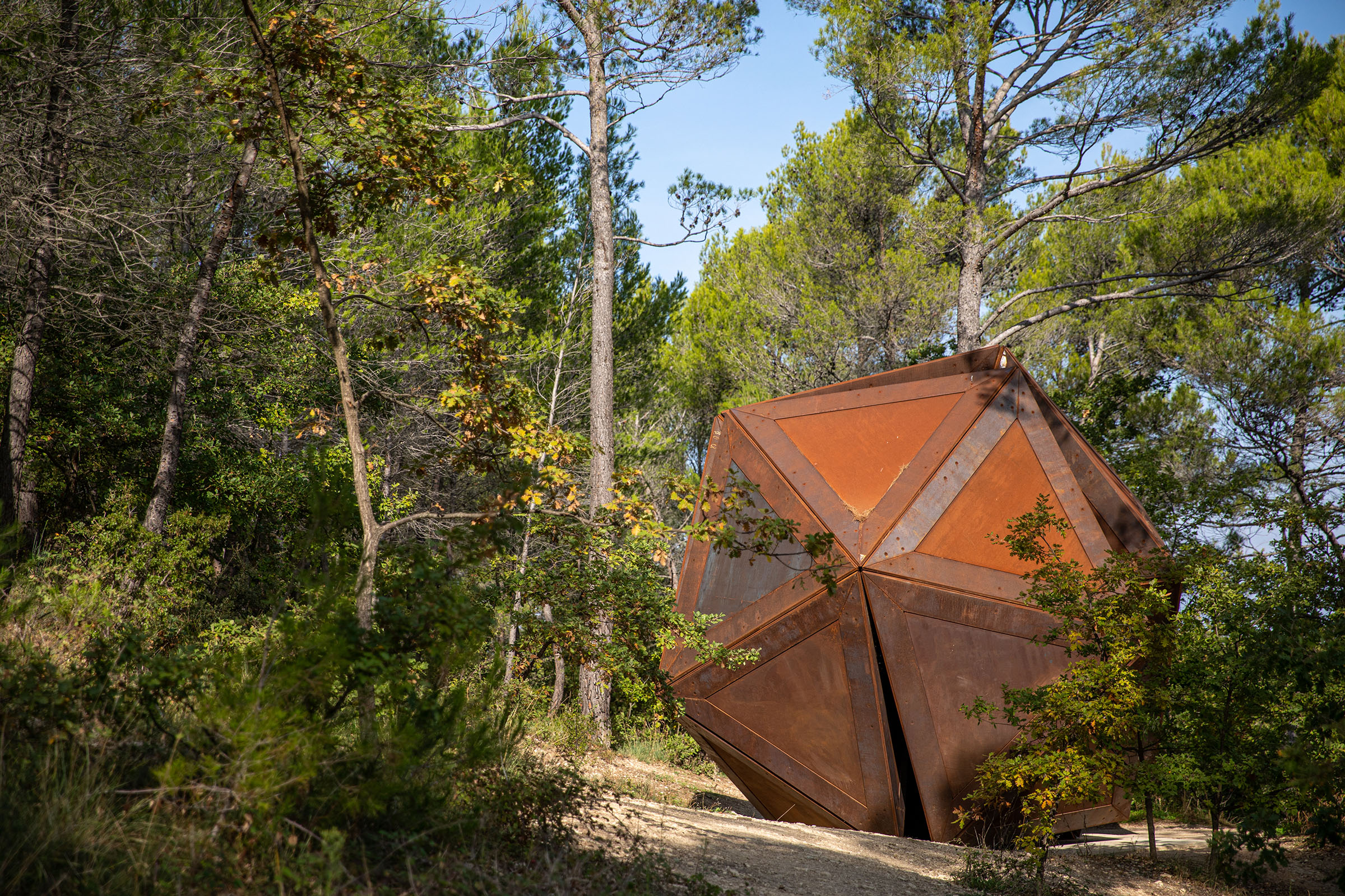 A hike through the estate's valleys and forests leads to an extraordinary array of carefully sited artworks, among them Schism, a sculpture made in 2020 by Conrad Shawcross