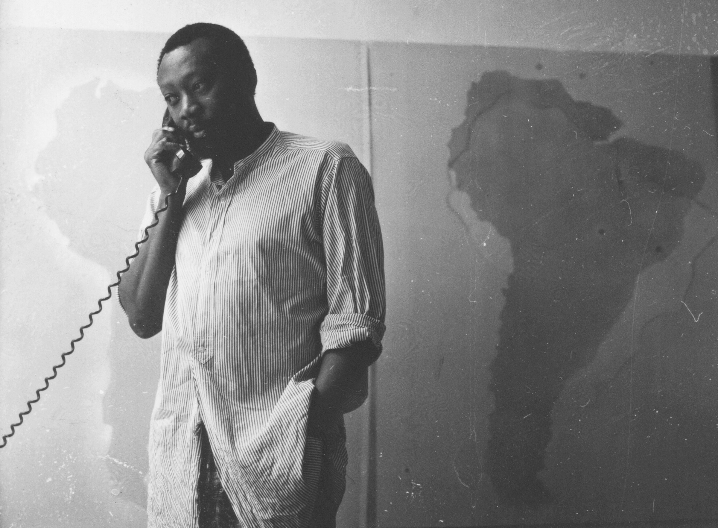 Frank Bowling in his studio at 535 Broadway, New York, in 1967, in front of one of his Map Paintings