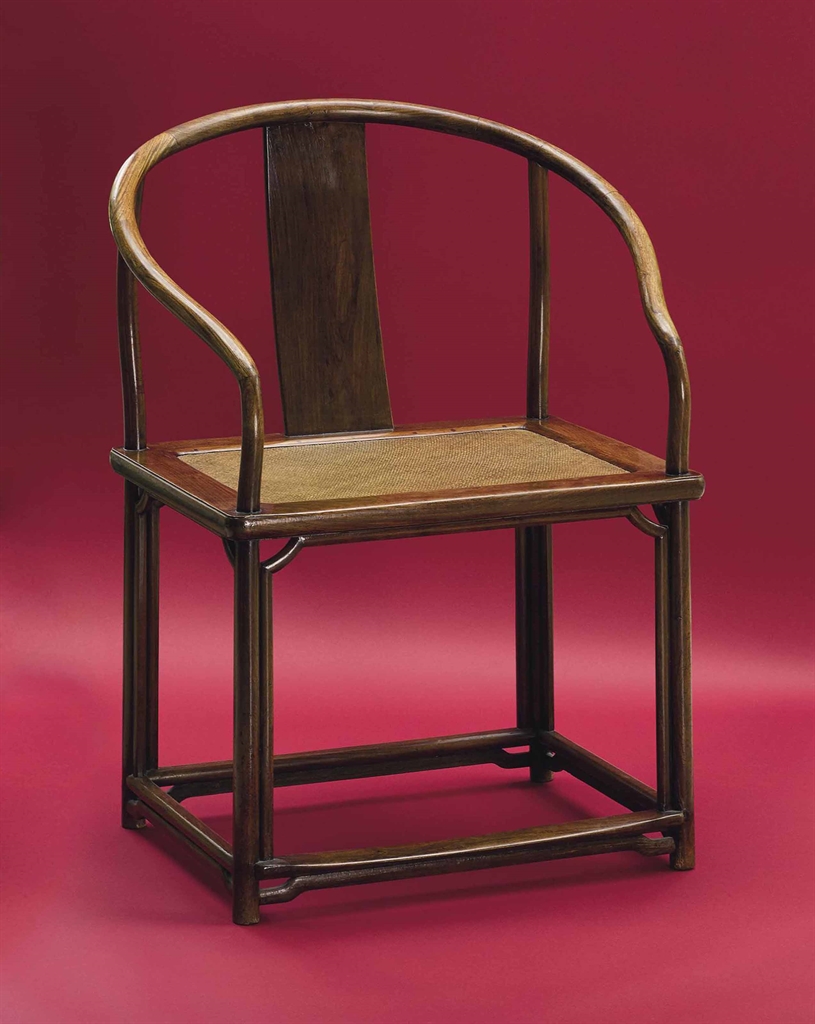 
A rare large huanghuali continuous horseshoe-back armchair, quanyi. 17th&ndash;18th century. Estimate: $250,000&ndash;300,000. To be offered in The Flacks Family Collection: A Very  Personal Selection, 16 September at Christie&rsquo;s New York