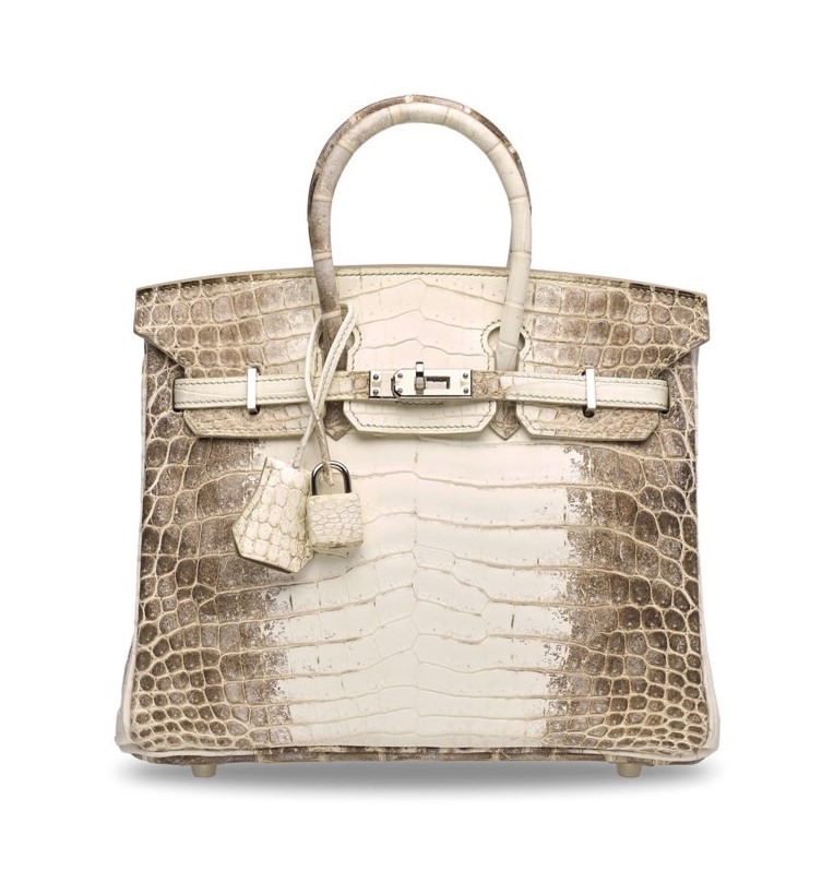 A luxury white and brown crocodile leather handbag with silver hardware and padlock detail.