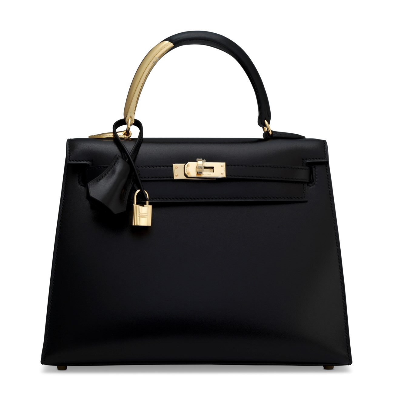 A black leather handbag with gold hardware and a top handle.