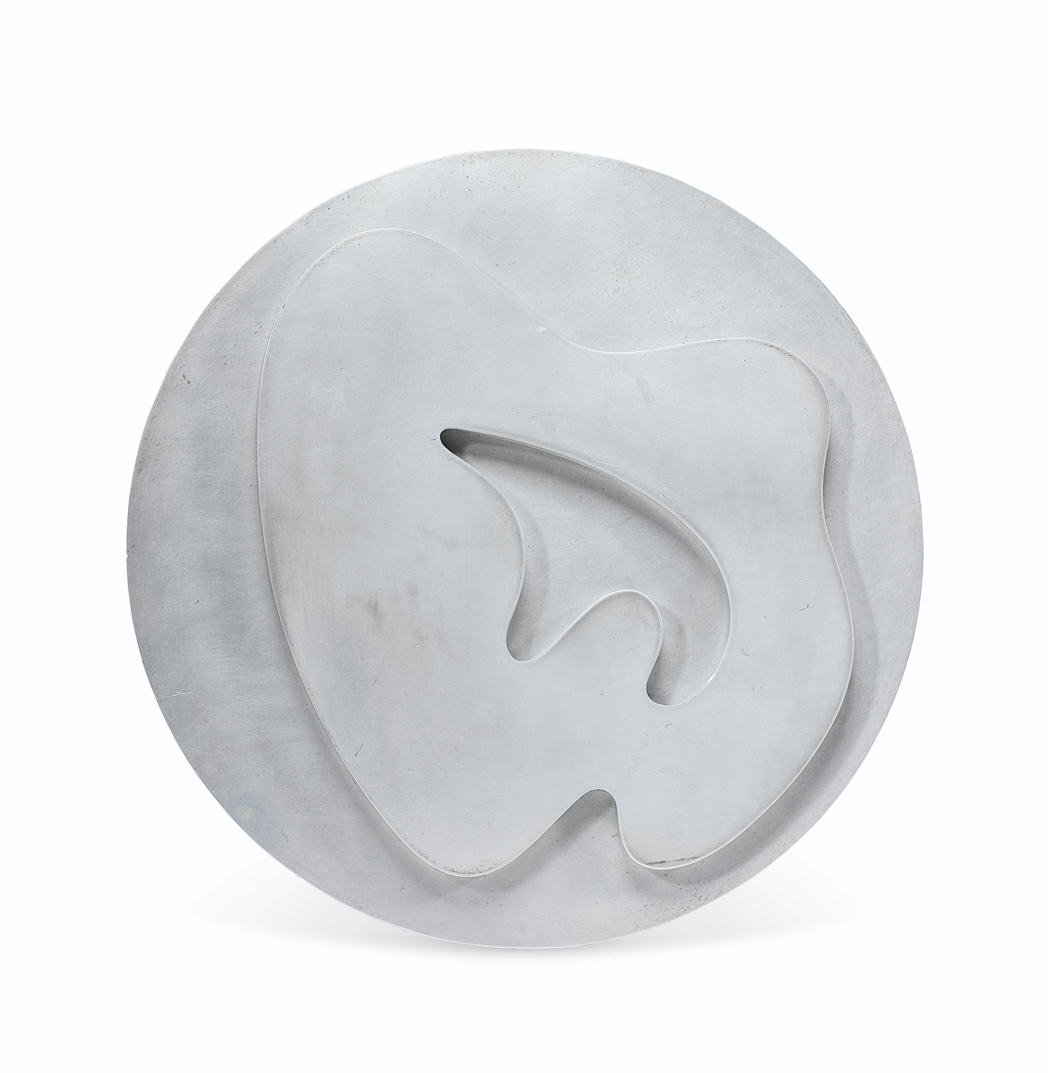 Jean (Hans) Arp (1895-1965), Composition dans un cercle no. 3, conceived and cast in 1962, signed and numbered 'ARP 1/5' (on the reverse). Duraluminium relief. Diameter: 11⅞ in (30.1 cm). Estimate: $10,000-15,000. Offered in Impressionist and Modern Art Day Sale on 14 May at Christie&rsquo;s in New York