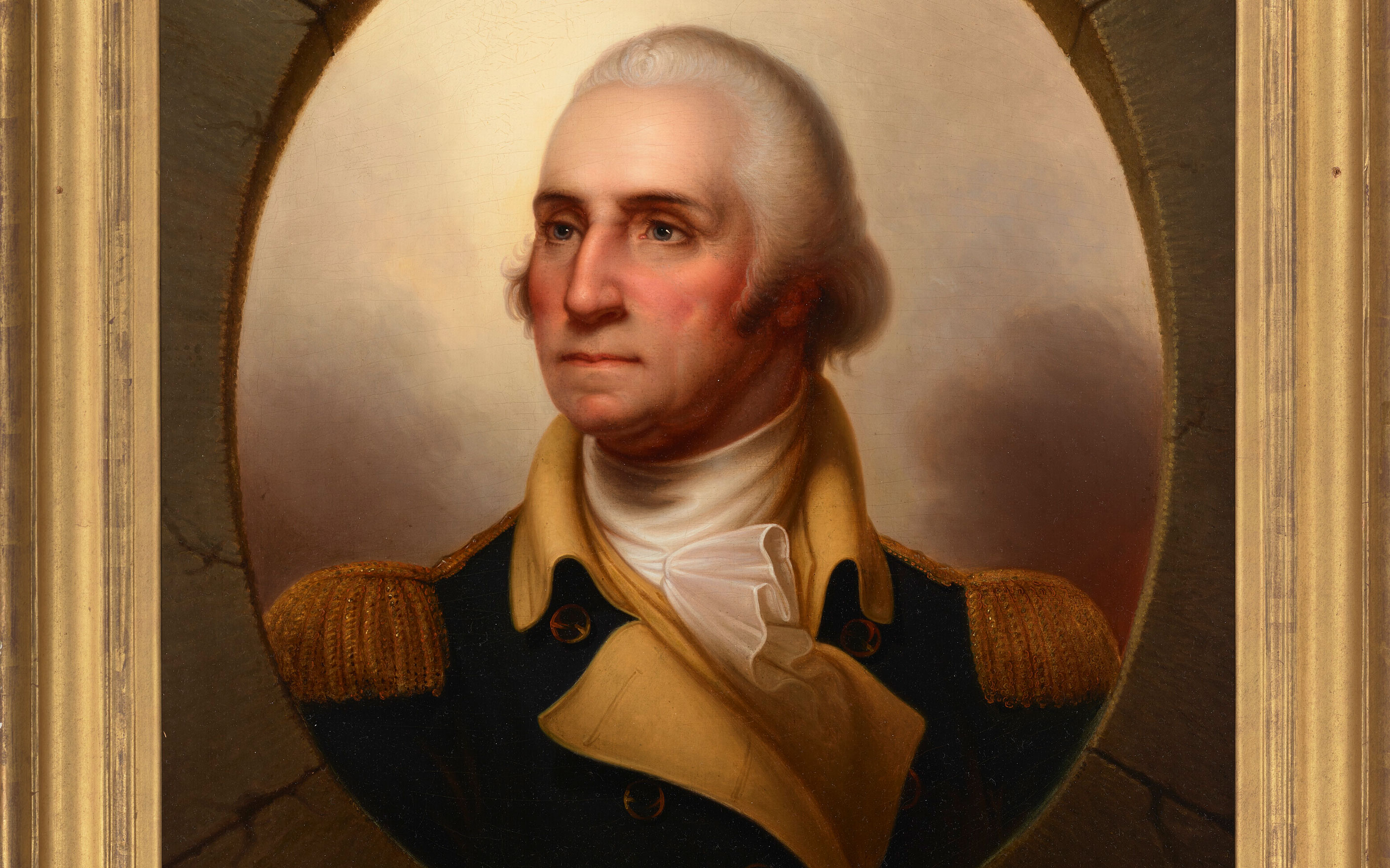 This is a classic portrait of a man in a dark navy military jacket with gold epaulettes, framed in an ornate gold frame.