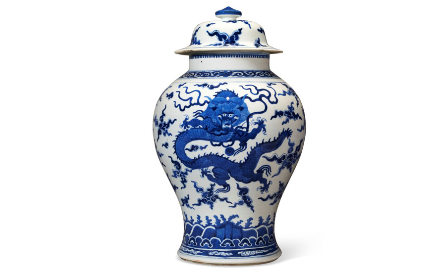 A blue and white porcelain vase featuring a detailed dragon design.