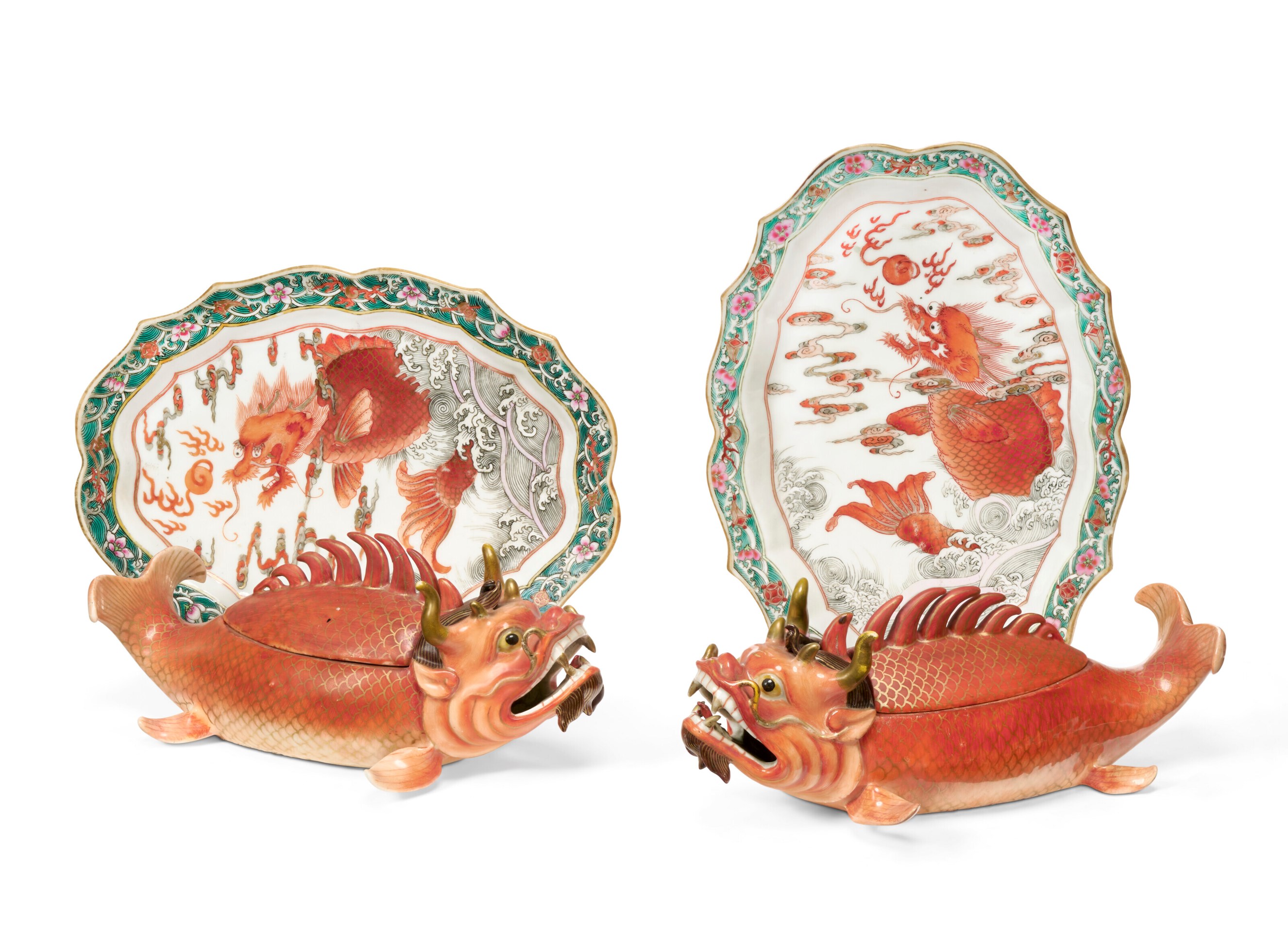 Two ornate ceramic dishes and two fish-shaped vessels with intricate dragon designs in traditional Asian style.