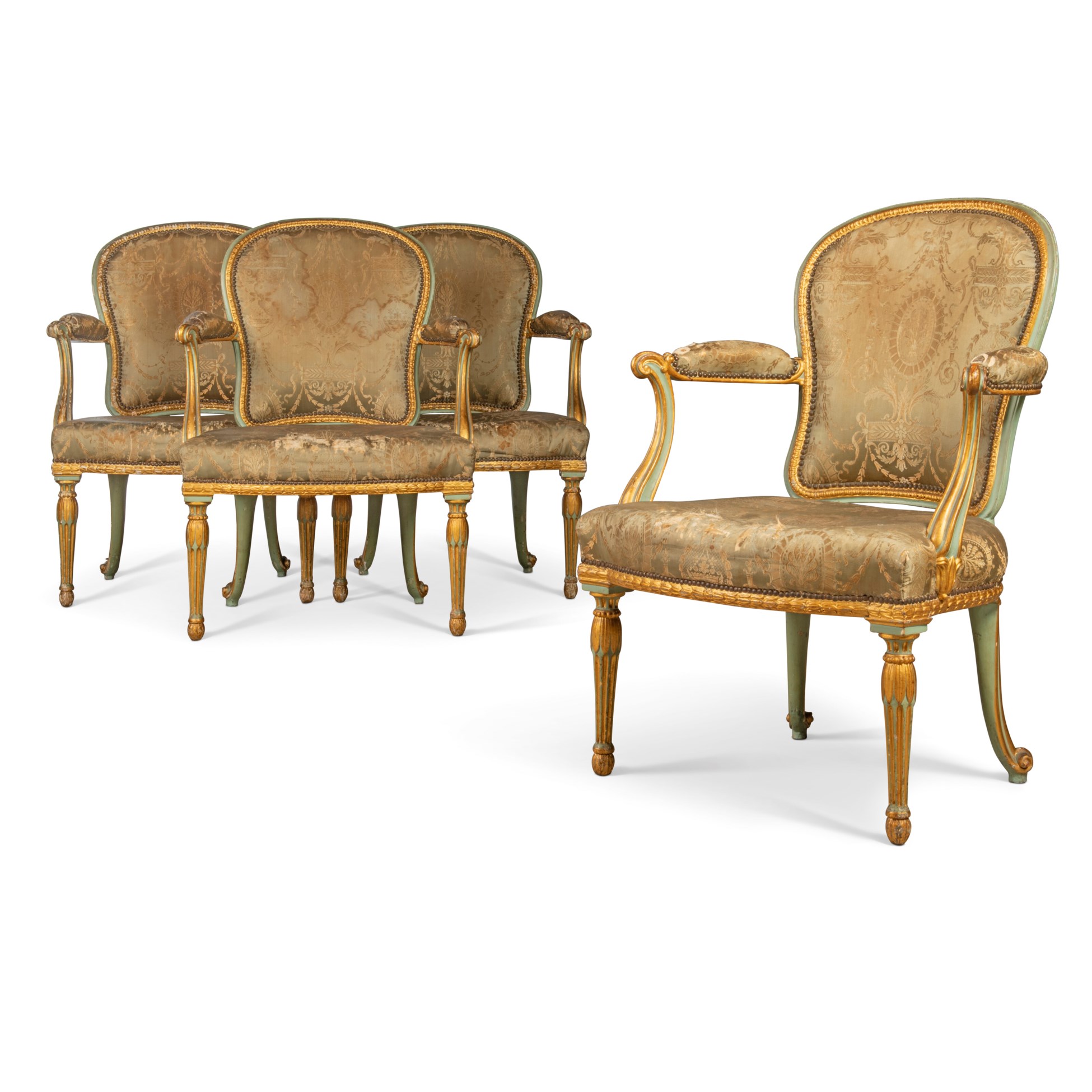 Set of antique French Louis XVI style chairs and sofa with ornate golden frames and faded upholstery.