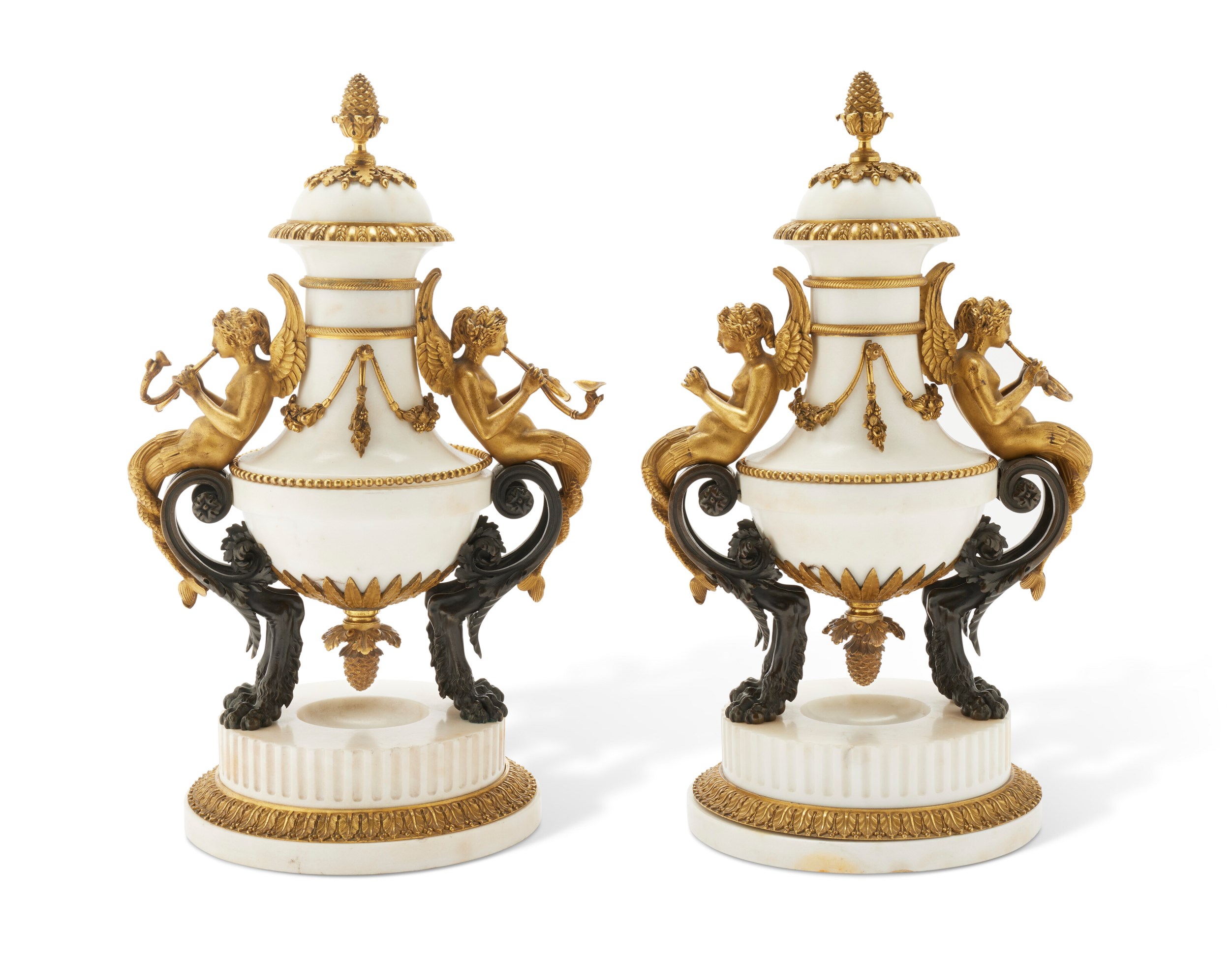 Two ornate white and gold urns with mythological figures and intricate decorations on a white round base.