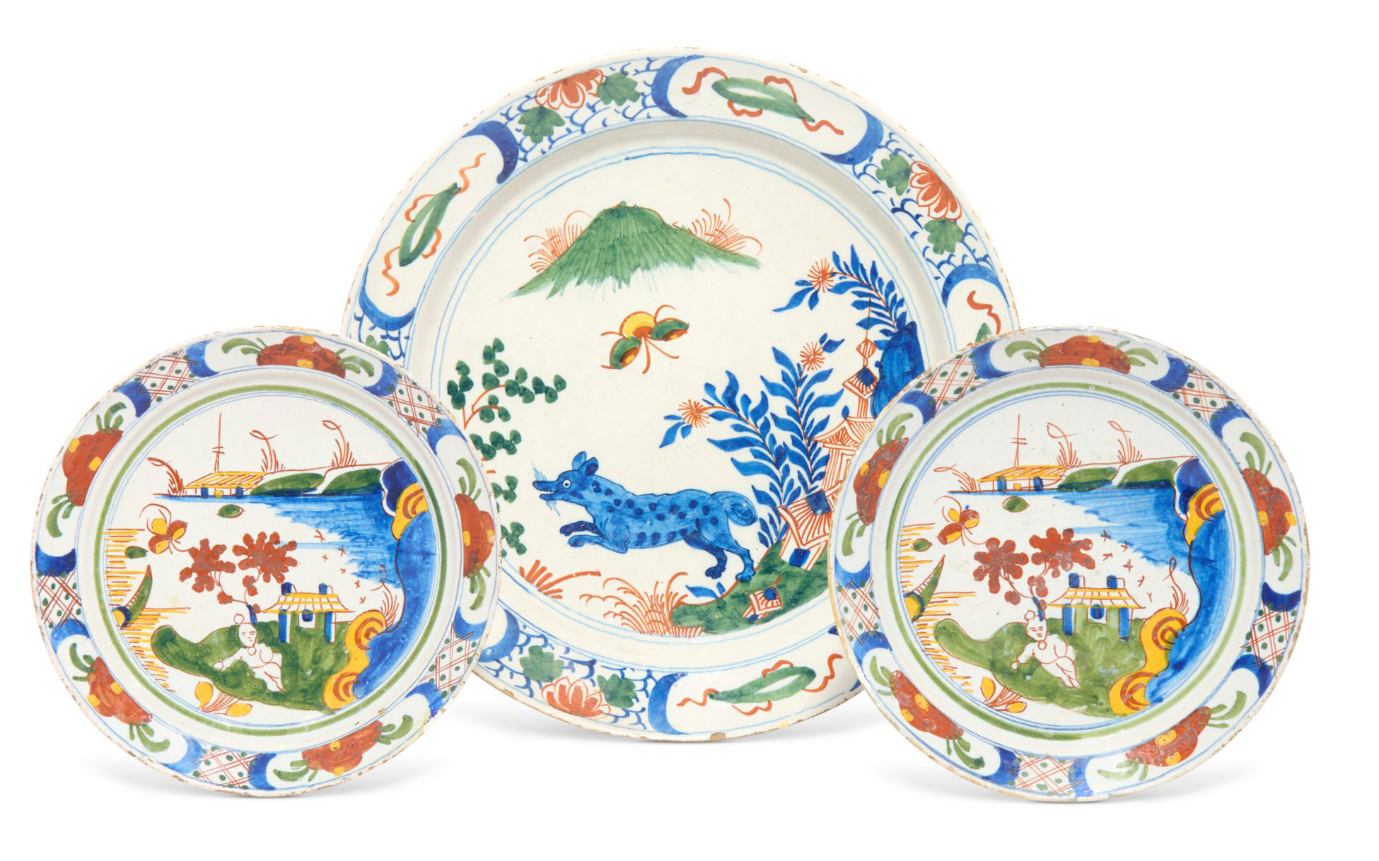 Three vibrantly decorated ceramic plates featuring traditional Eastern scenes with animals, flora, and landscapes.