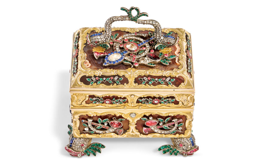Ornately decorated small chest, embellished with colorful enamel and gemstones, featuring a floral and bird design.